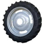 Close-up of a black rubber tire with a silver metal rim.