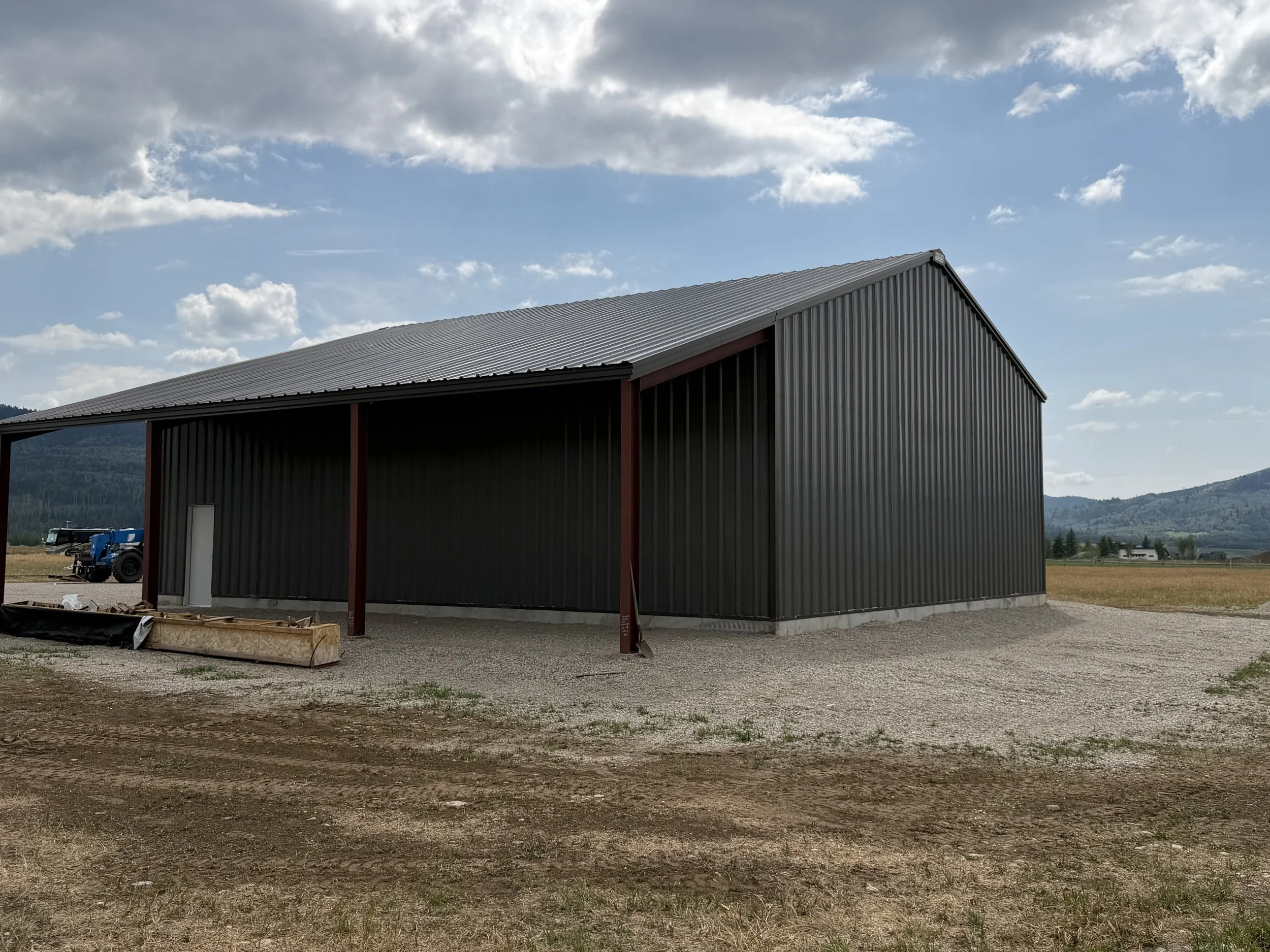 Dark-gray metal siding and roof installed during construction of the Victor steel shop.