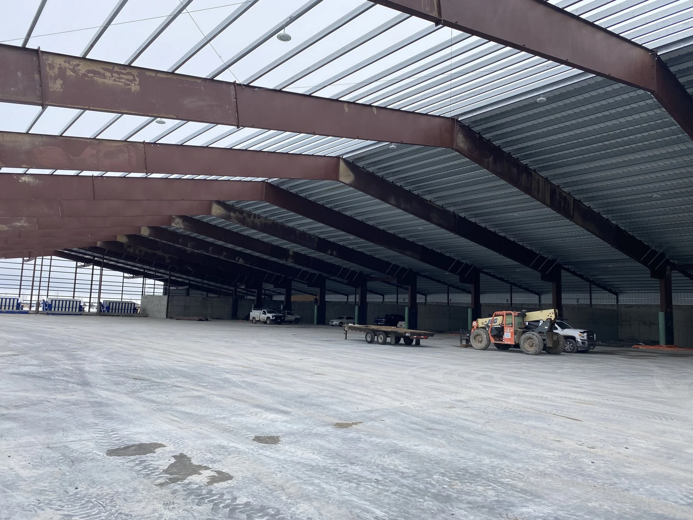 Commercial steel building frame erection during structural construction