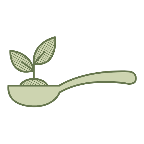 Une louche avec deux feuilles verte