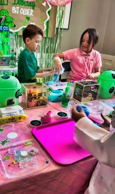 Children at a birthday party making slime  with the host of 67 SLIME Co. Mobile Slime Lab.
