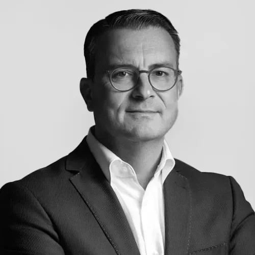 Black and white portrait of SkyGeo’s Chief Financial Officer, overseeing financial strategy for the company’s global InSAR monitoring services.