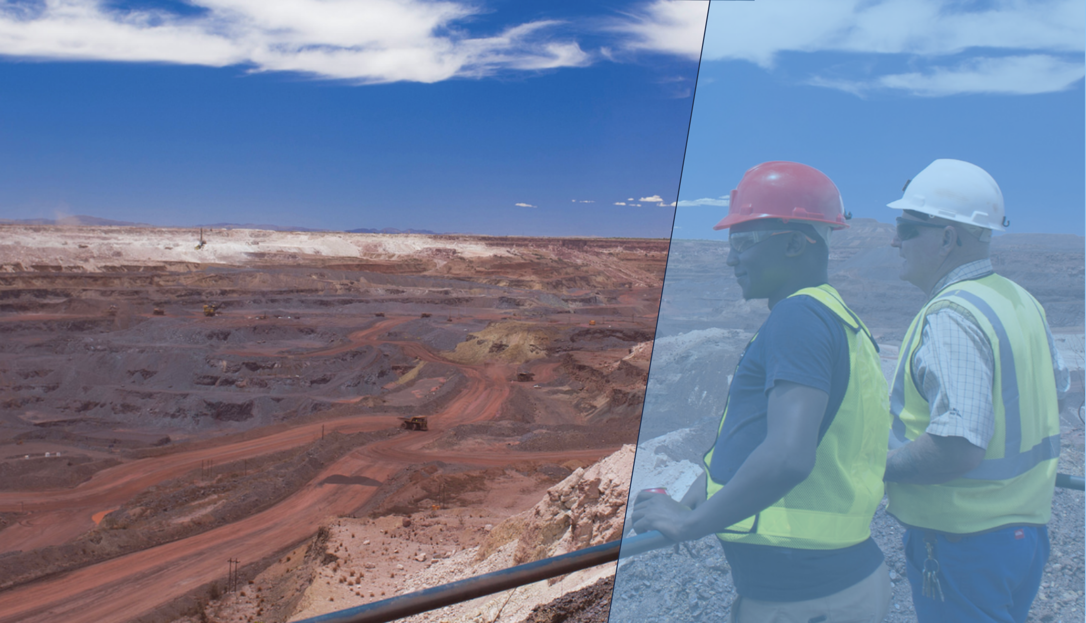 Two construction workers in helmets and safety vests reviewing plans on site, using InSAR insights to guide geotechnical risk mitigation in the field.