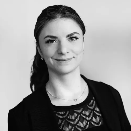 Professional black and white portrait of Jacqueline Salzer from the SkyGeo leadership team, working with InSAR satellite data on complex geotechnical risk cases.