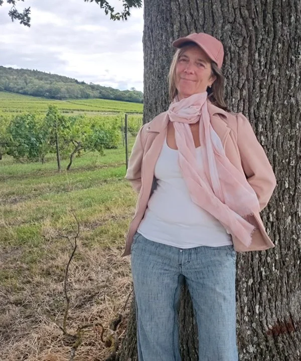Nora Rose Zinerman leaning against a tree in the Surrey Hills