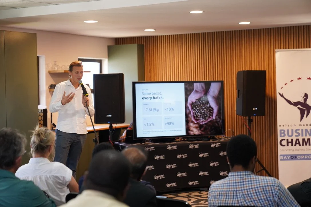 Cas Snijders presenting biomass wood pellets and industrial boiler conversions at Coega Biomass Centre's Coffee Morning.
