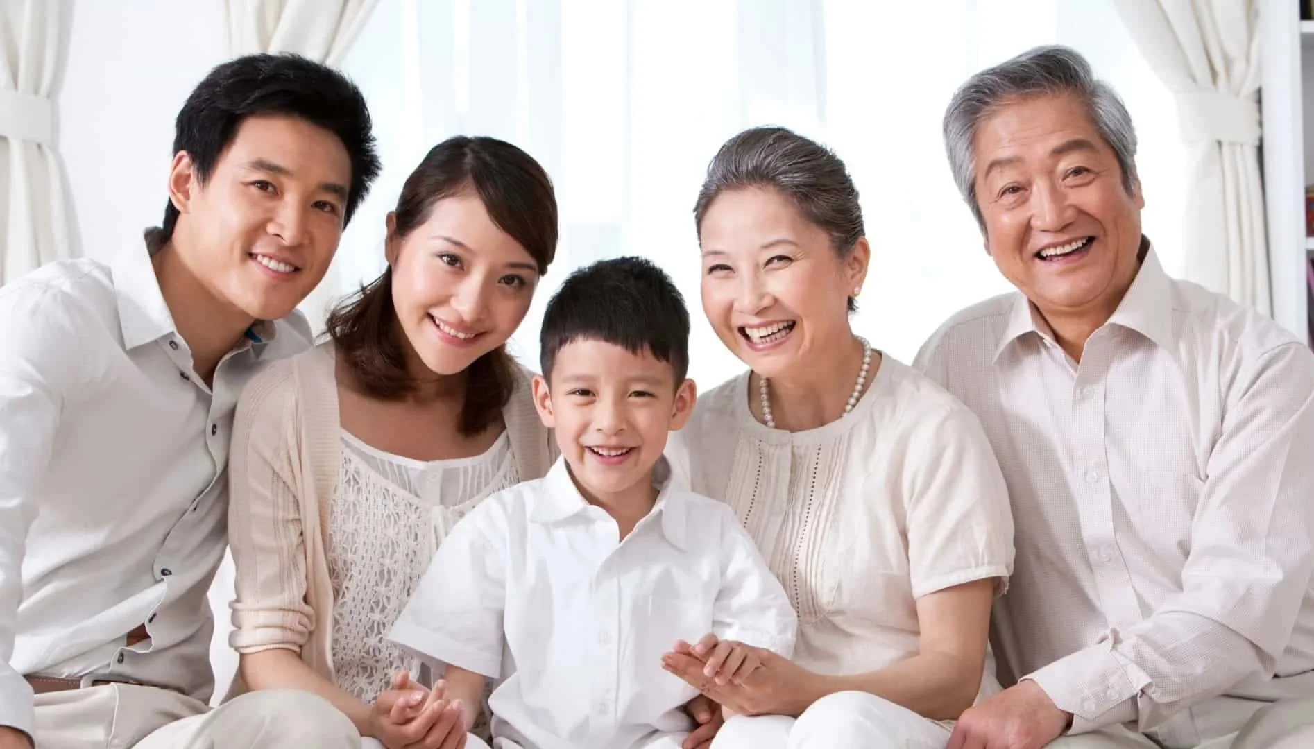 Multigenerational Asian family smiling indoors, representing LifeBank Stem Cells’ mission in regenerative therapy, healthy ageing, and personalised wellness.