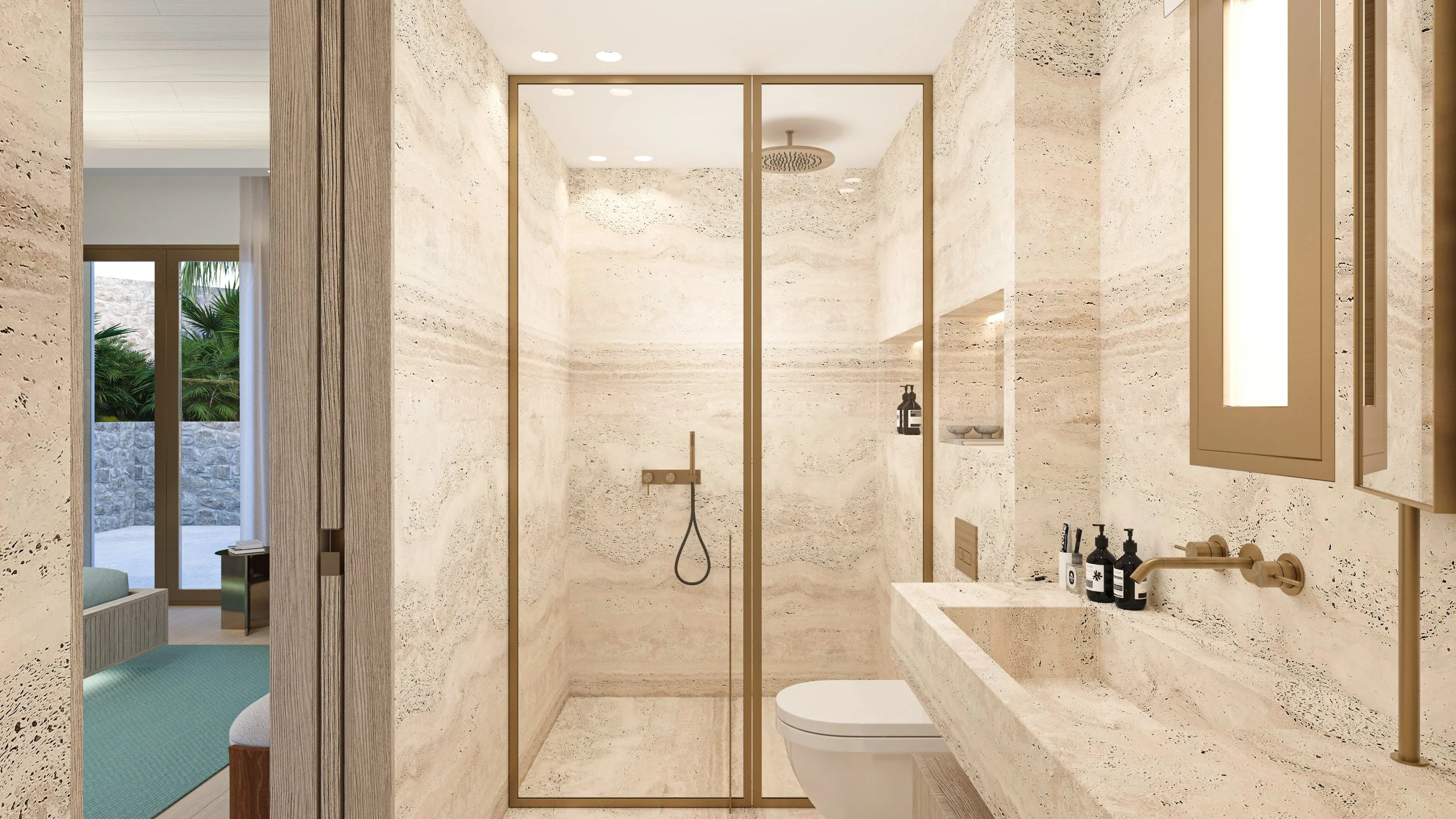 Salle de bain moderne avec murs en pierre beige, douche avec parois en verre, lavabo intégré dans un comptoir en pierre, porte de cabinet murale, reflets de la chambre avec vue sur un patio en pierre et végétation.