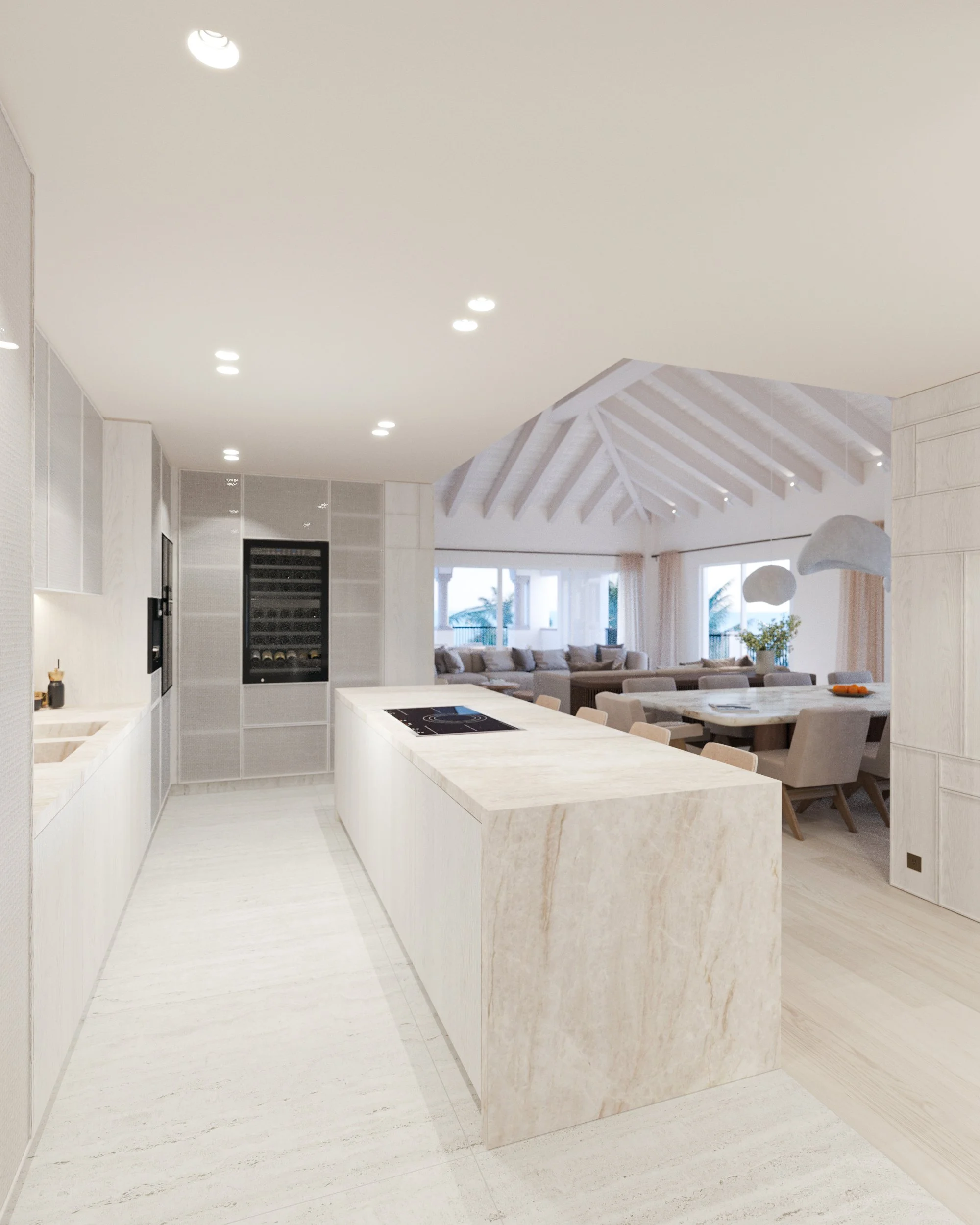 Cuisine moderne avec îlot central en pierre, espace ouvert avec salle à manger et salon lumineux, plafond à poutres apparentes blanches, grande baie vitrée, décor épuré