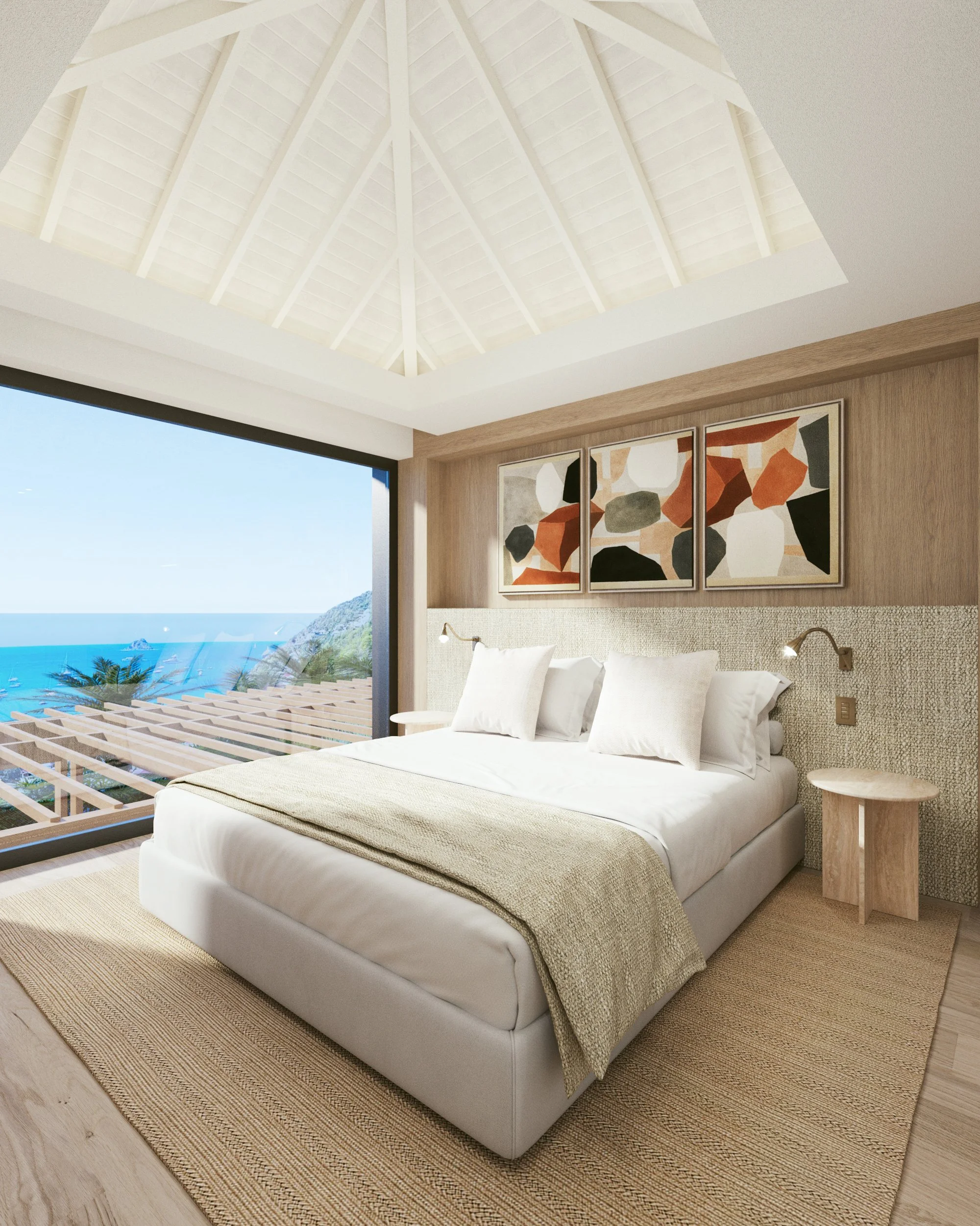 Chambre offrant une vue panoramique sur la mer avec un lit blanc, draps beiges, œuvres d'art abstraites, et mobilier en bois naturel dans une ambiance moderne et lumineuse.