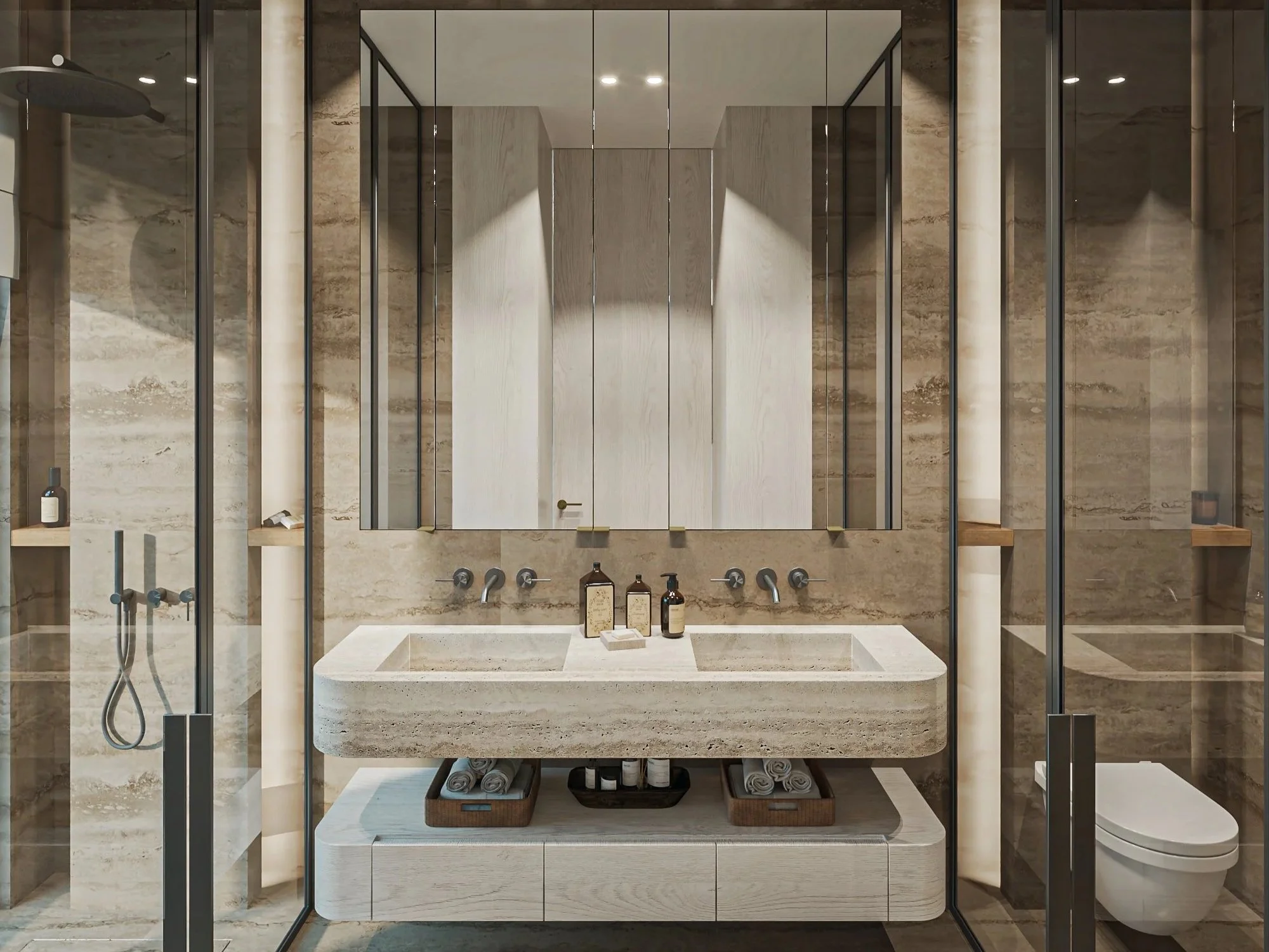 Salle de bain moderne avec double lavabo en pierre, miroirs, cabine de douche en verre, et toilette suspendue, décor en pierre beige.