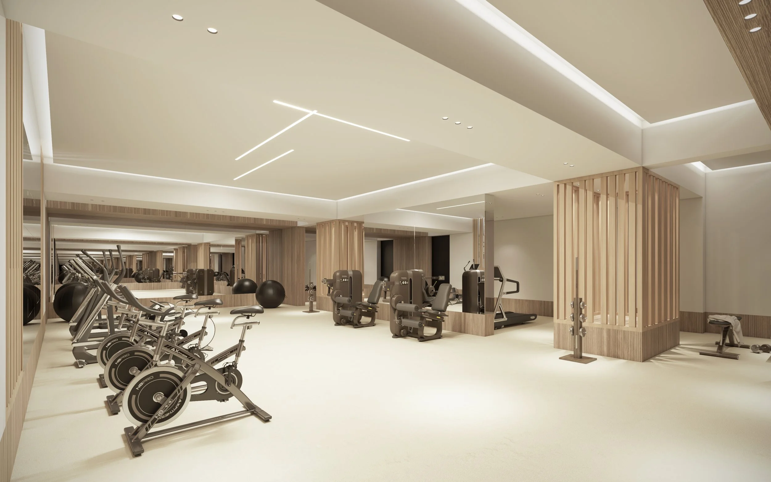 Salle de sport moderne avec équipements d'exercice comme vélos stationnaires, machines de musculation, ballons de stabilité, et un mur de miroirs