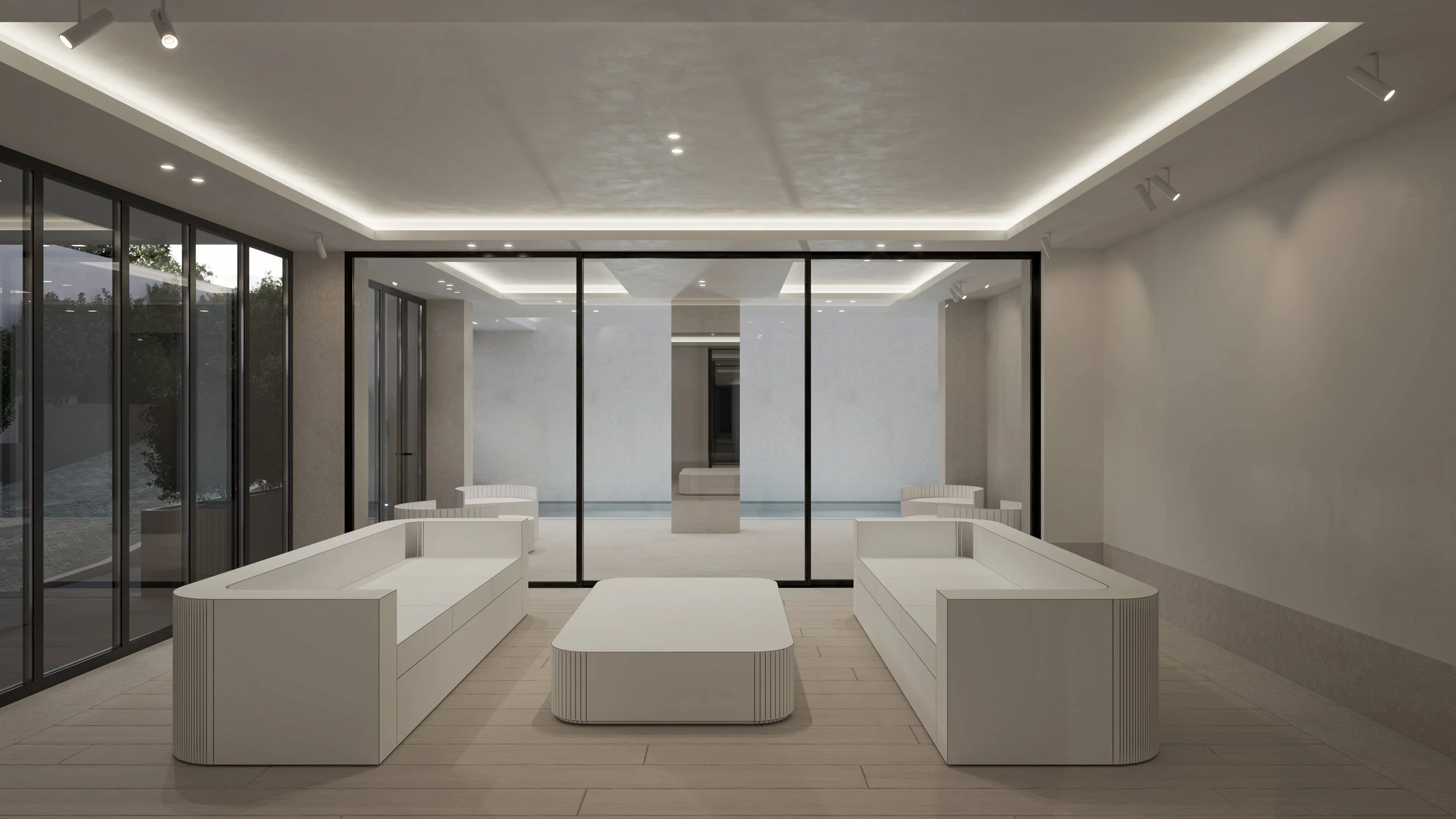 Salon moderne avec deux canapés blancs et une table centrale, grandes fenêtres en verre, éclairage encastré au plafond, design minimaliste.