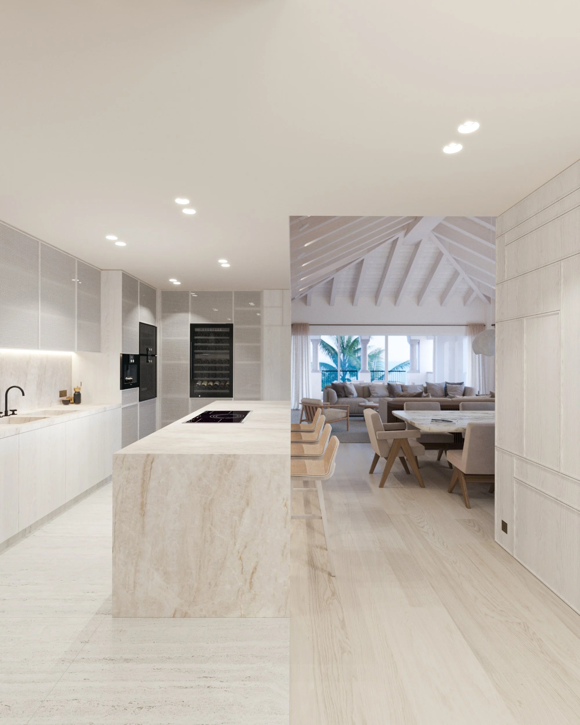 Intérieur d'une cuisine moderne et lumineuse avec îlot en marbre et espace salon avec canapés et vue sur la mer