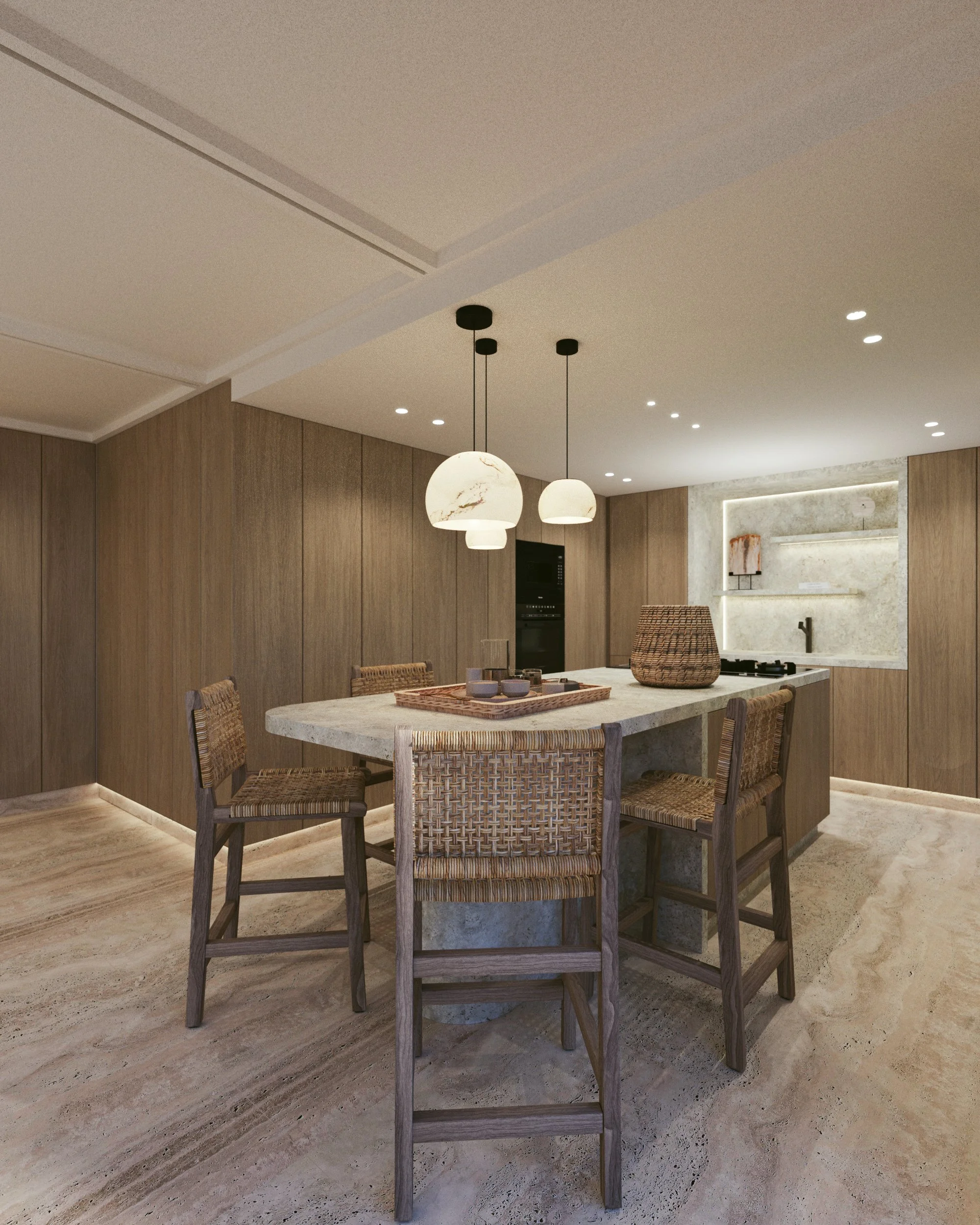 Cuisine moderne avec îlot central en pierre, chaises en bois et rotin, éclairage suspendu, murs en bois clair et armoires intégrées, sol en pierre beige, décor minimaliste.