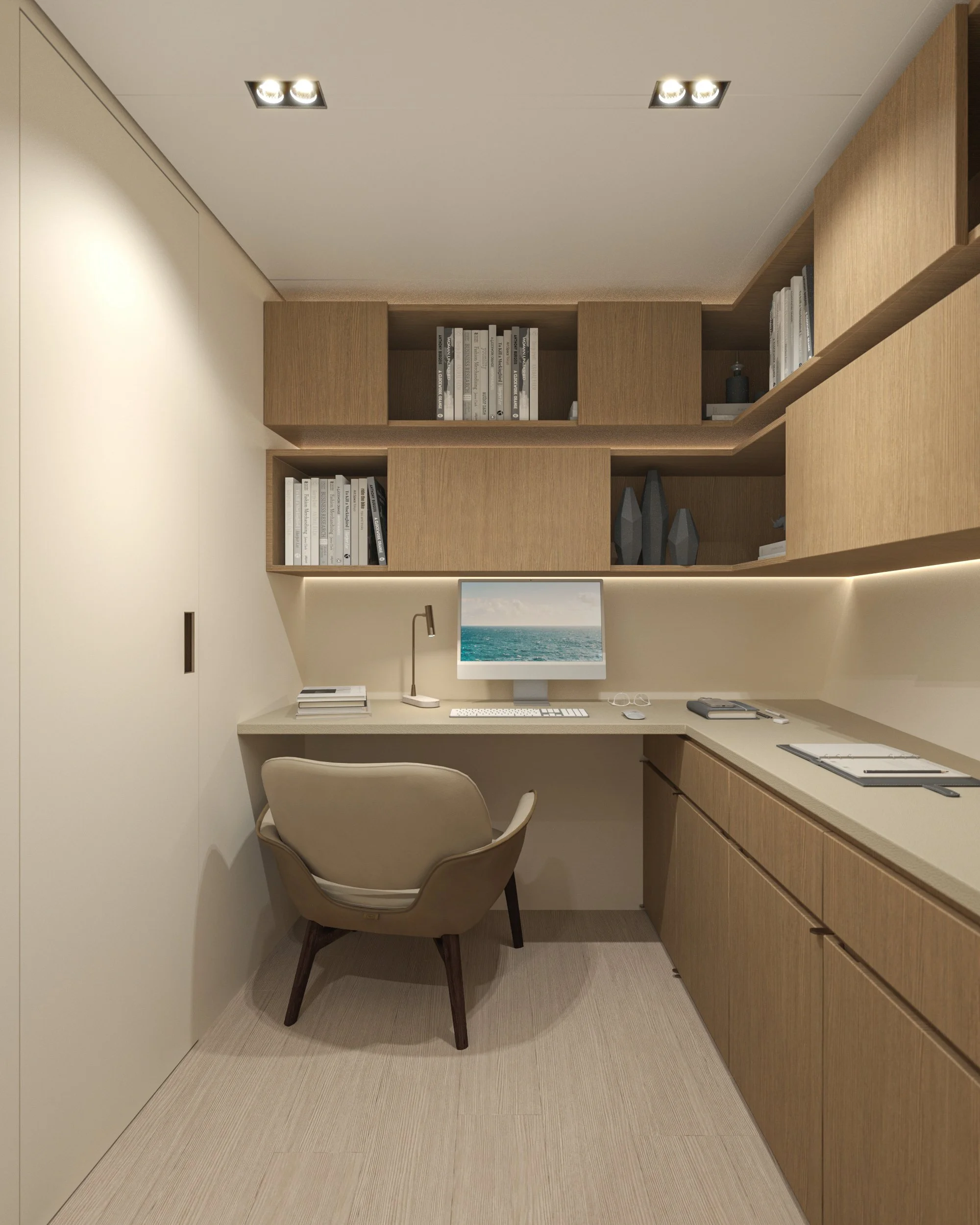 Bureau moderne en bois clair avec étagères, ordinateur, lampe de bureau, fauteuil beige, et rangements.