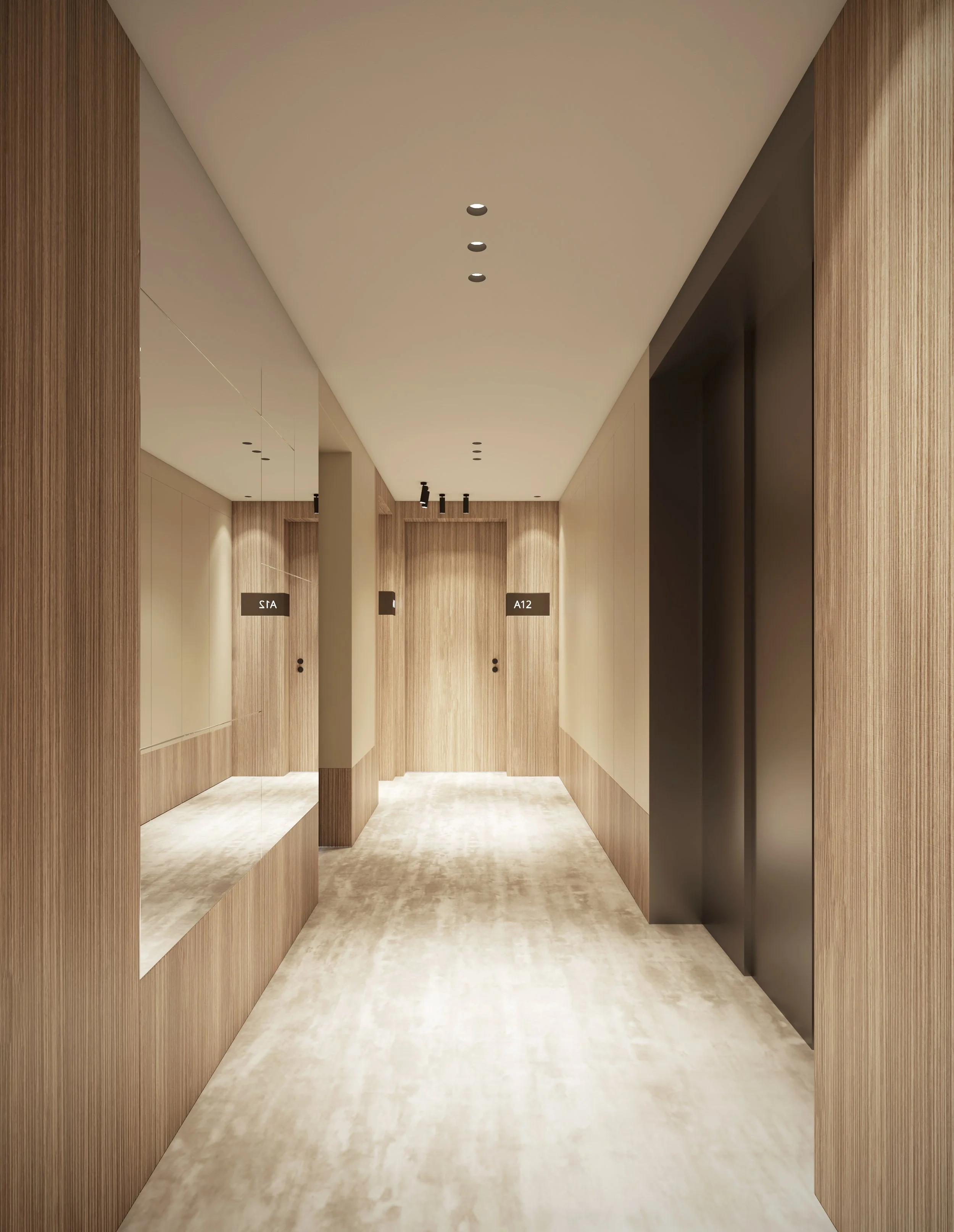 Couloir dans un bâtiment moderne avec murs en bois, plafond beige, sol en marbre clair, et deux ascenseurs noirs, portes d'ascenseur avec panneaux indiquant 'STA' et 'A12'.