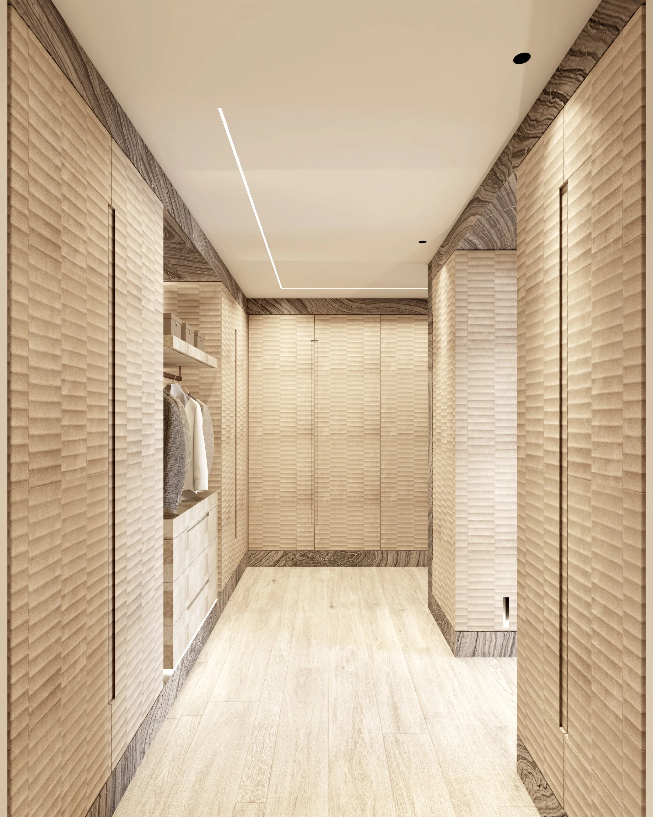 Un dressing moderne avec des murs en lambris esthétique en beige clair, sol en bois clair, et armoires encastrées.