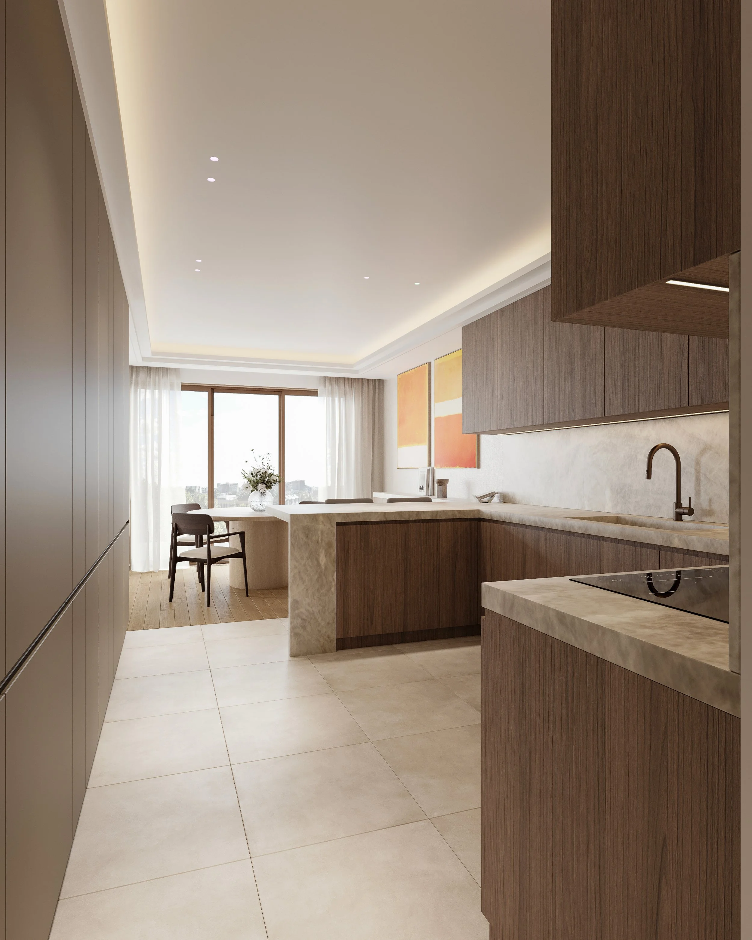 Cuisine moderne avec plan de travail en marbre, armoires en bois, évier noir, et tableaux colorés sur le mur. Espace lumineux avec grande fenêtre et rideaux blancs.