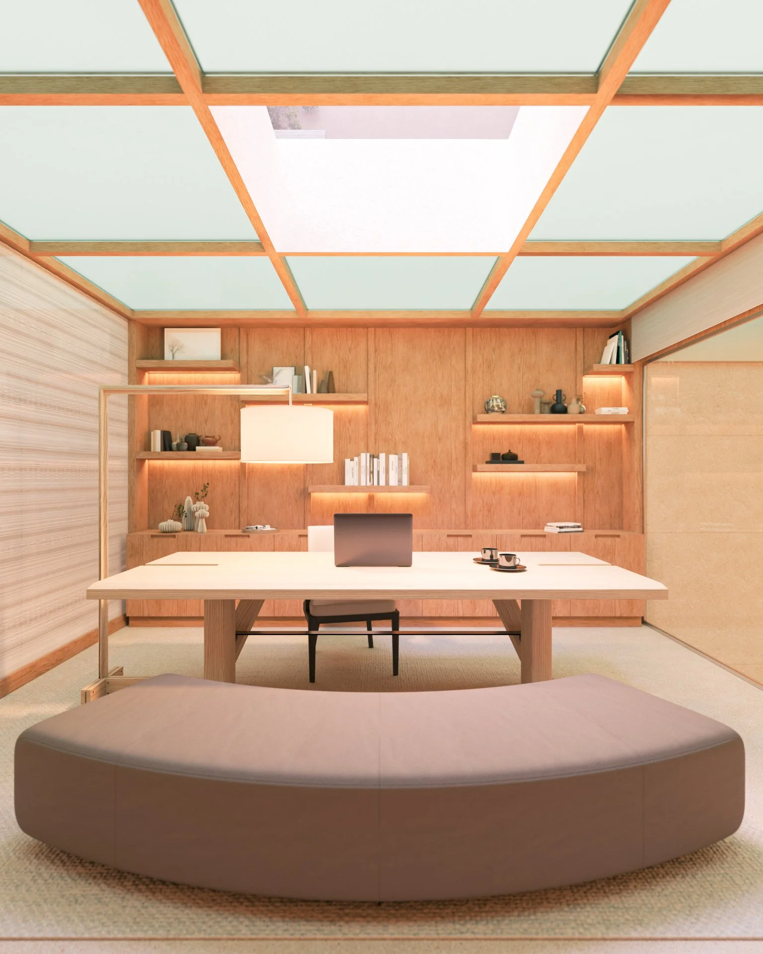 Une pièce de bureau moderne en bois avec une table blanche, un ordinateur portable, des tasses, des étagères éclairées contenant des livres et des objets décoratifs, un lampadaire suspendu et un canapé beige au premier plan.