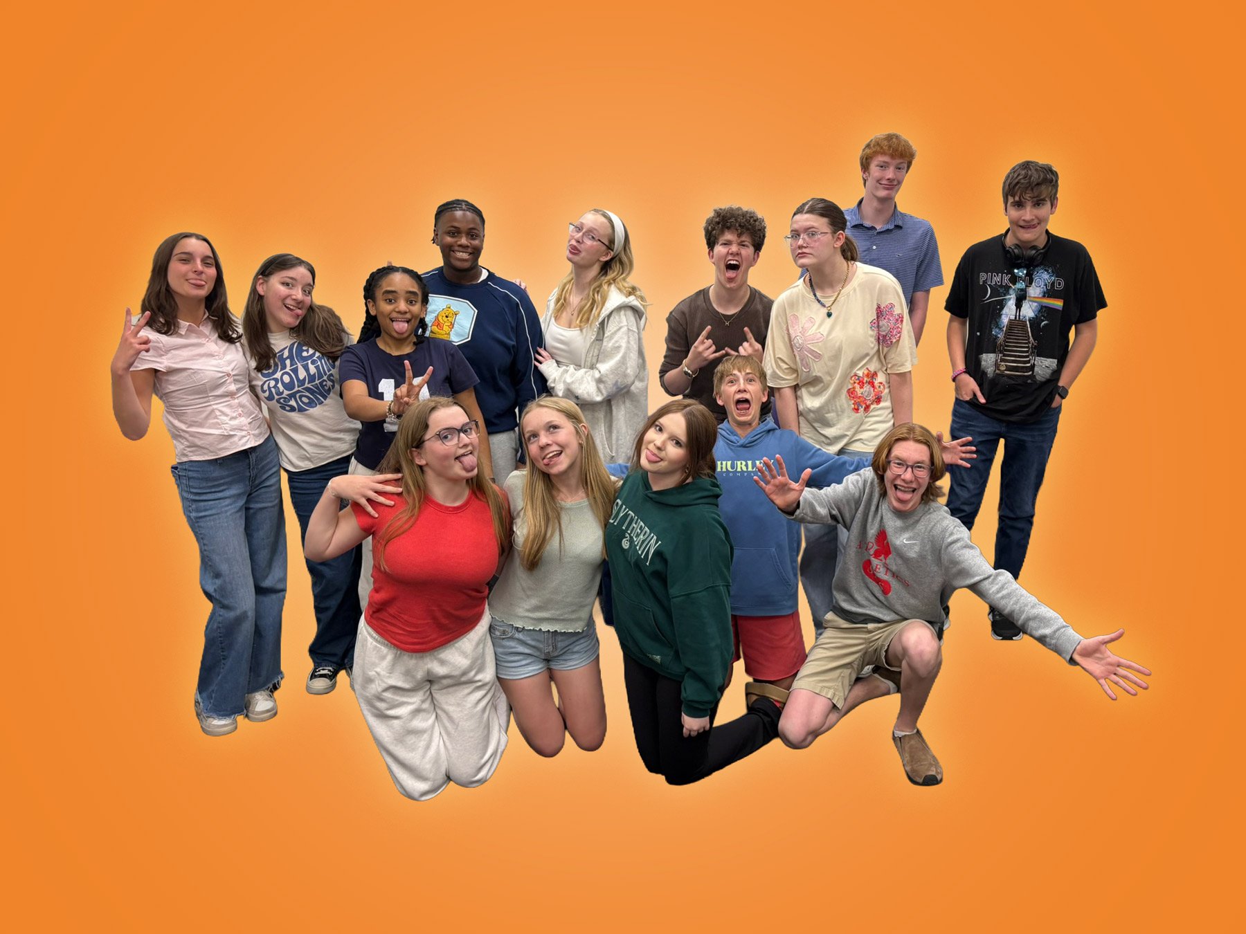 Group of teenagers and young adults smiling and making playful gestures against an orange background.