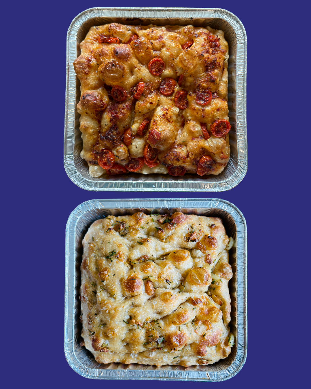 Two aluminum trays of baked dishes, top one with chicken, red peppers, and cheese, bottom one with cheese and herbs.