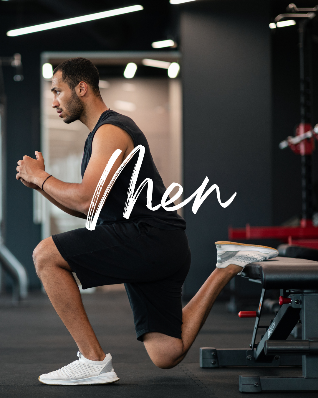 A man working out in a gym, kneeling on one knee with hands clasped, wearing black athletic wear and white sneakers, with the word 'Men' written across the image.