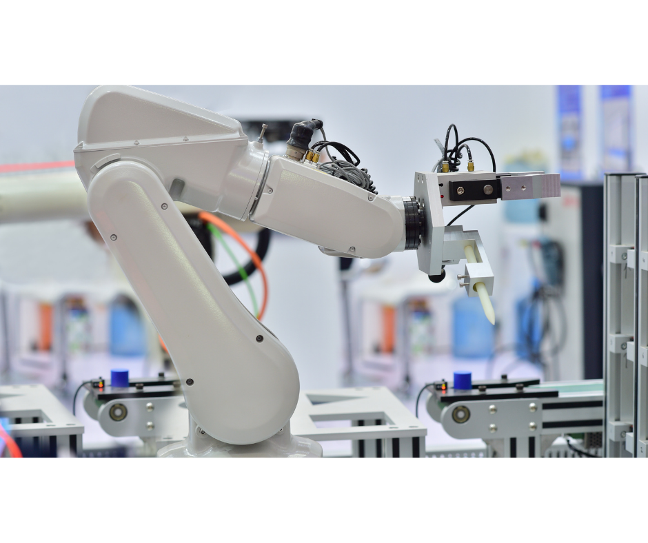 Industrial robotic arm that contains rare earth magnets operating with a tool attachment in a manufacturing setting/