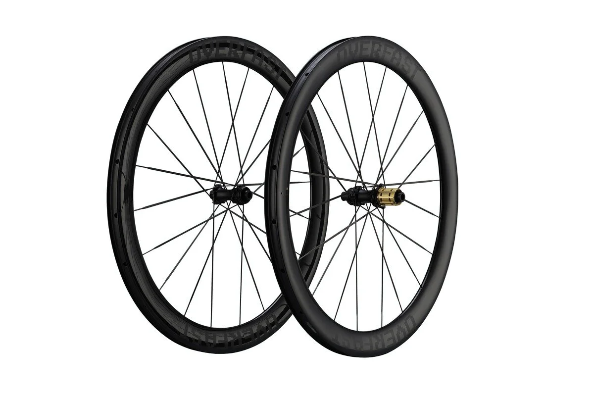 Two black bicycle wheels with black tires, spokes, and hubs, positioned against a white background.