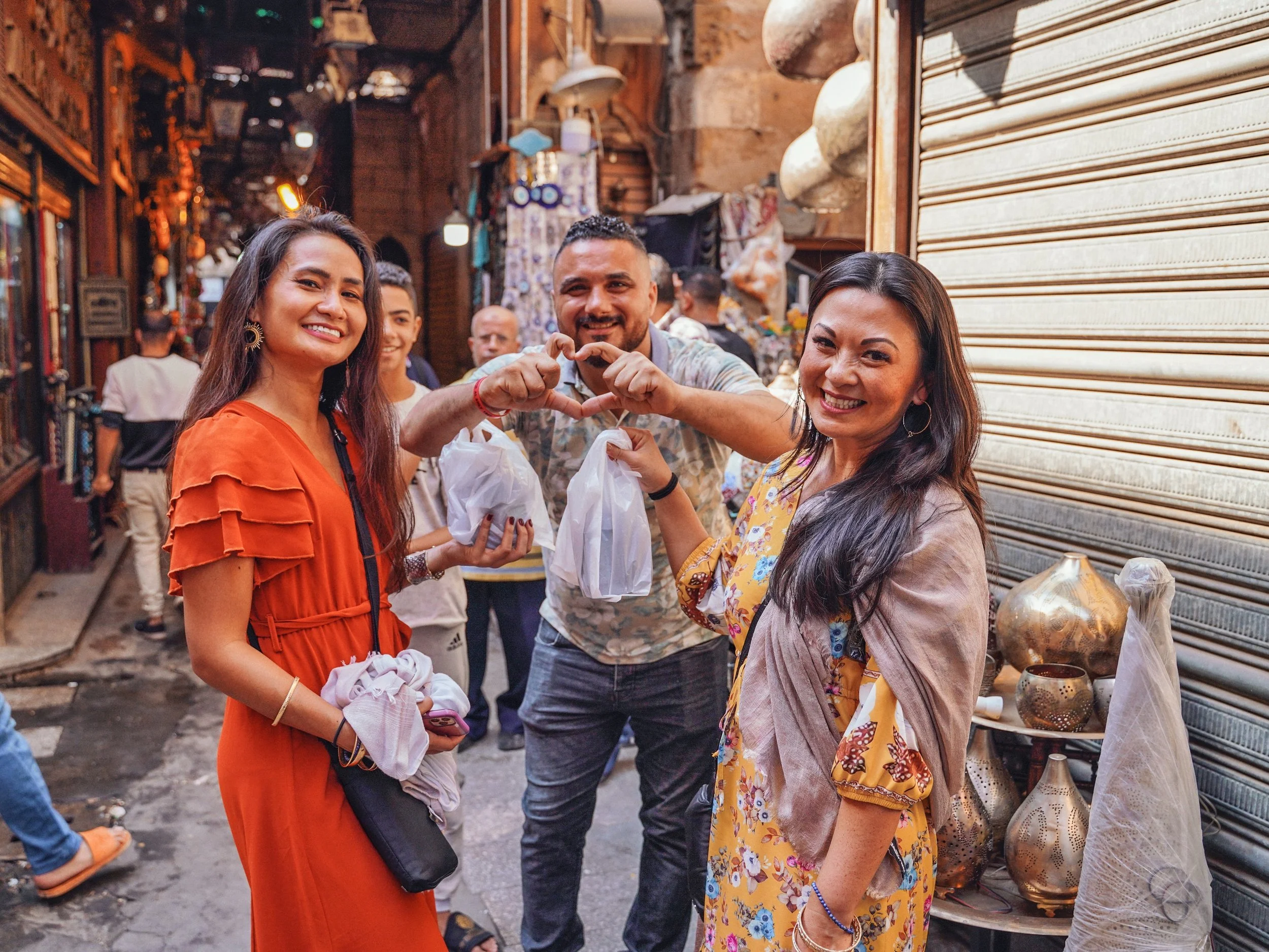 Two American tourists shopping in the market of Old Cairo