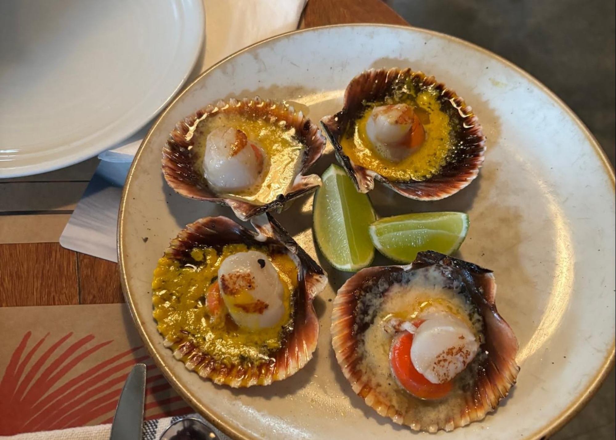 Luxury dining in Peru. Scallops on the shell.