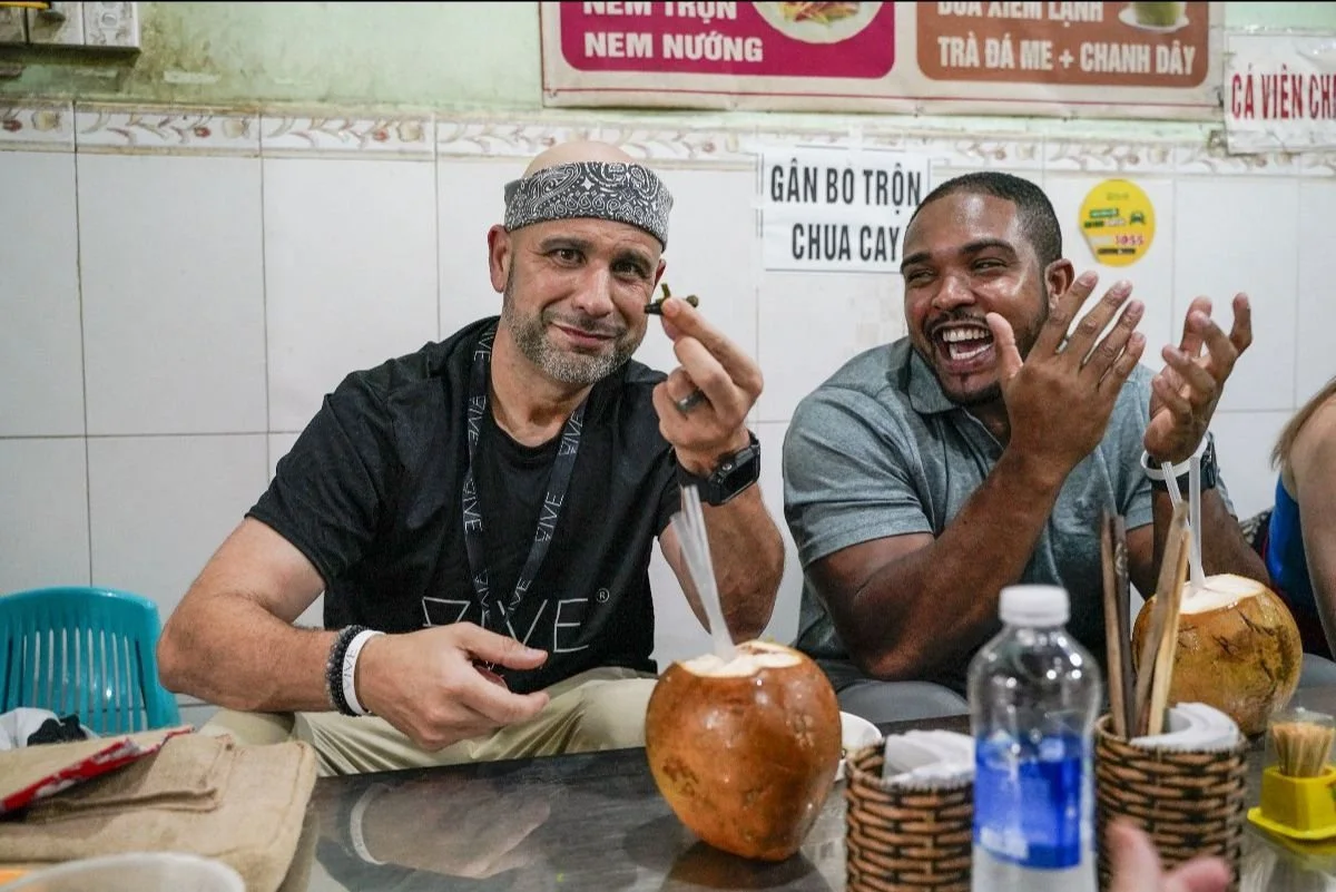 Tourist trying fried bugs in Vietnam