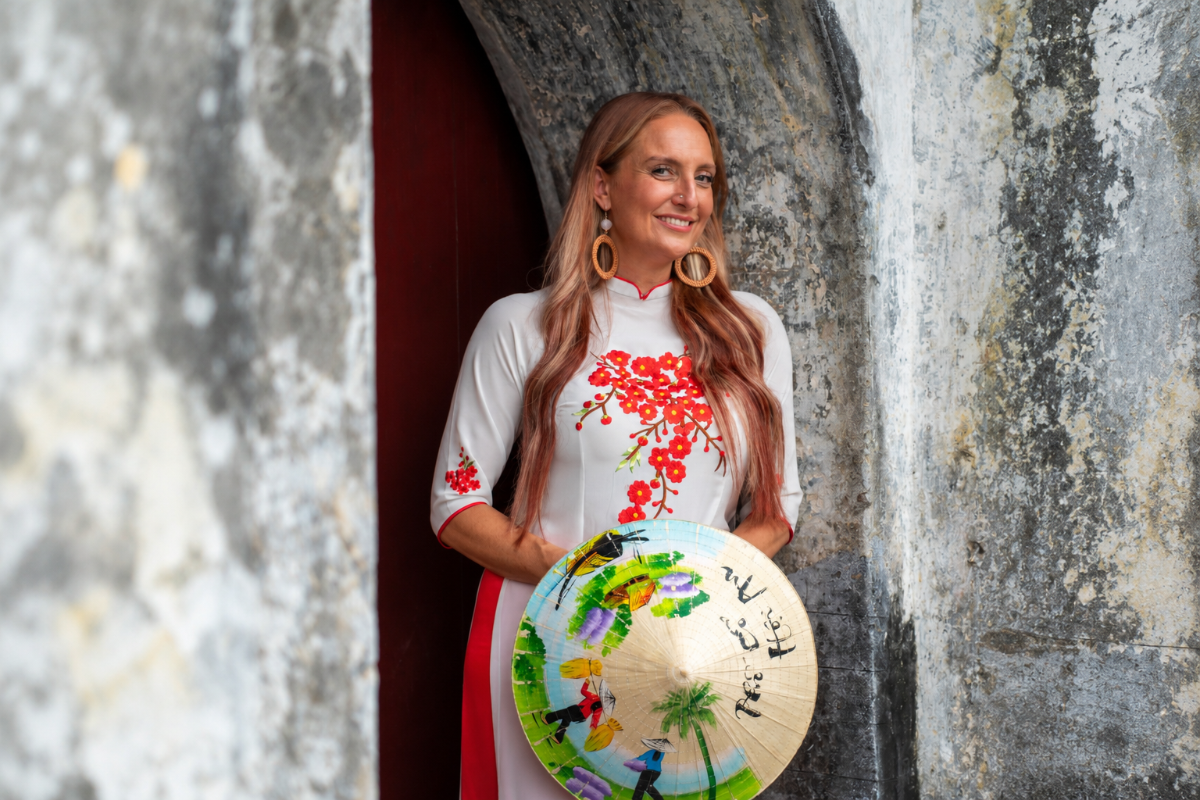 Michelle Ruiz Yoga - teacher and founder of VIVE Society, trying on traditional clothing in Vietnam