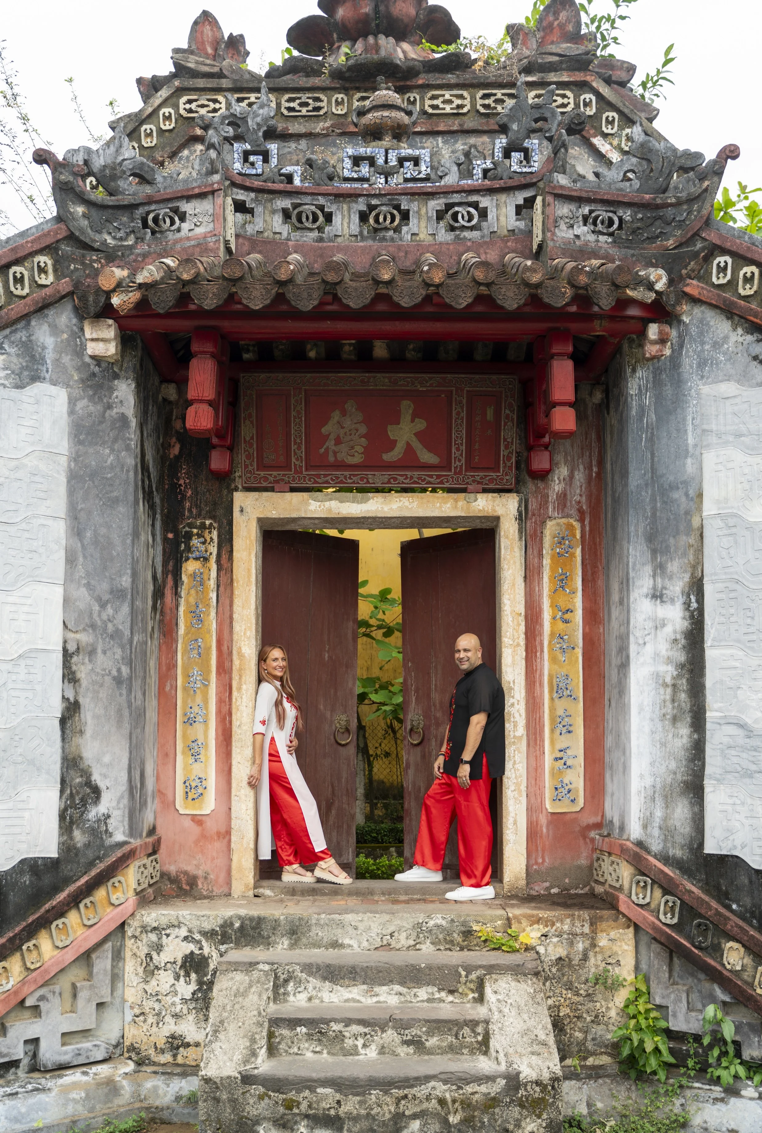 couple photoshoot in traditional clothing at temple in Hoi An, Vietnam