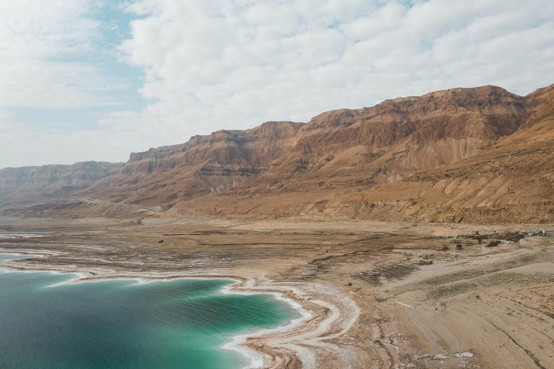 Turquoise waters and sandstone cliffs around the Dead Sea, beautiful wide shot of the Dead Sea