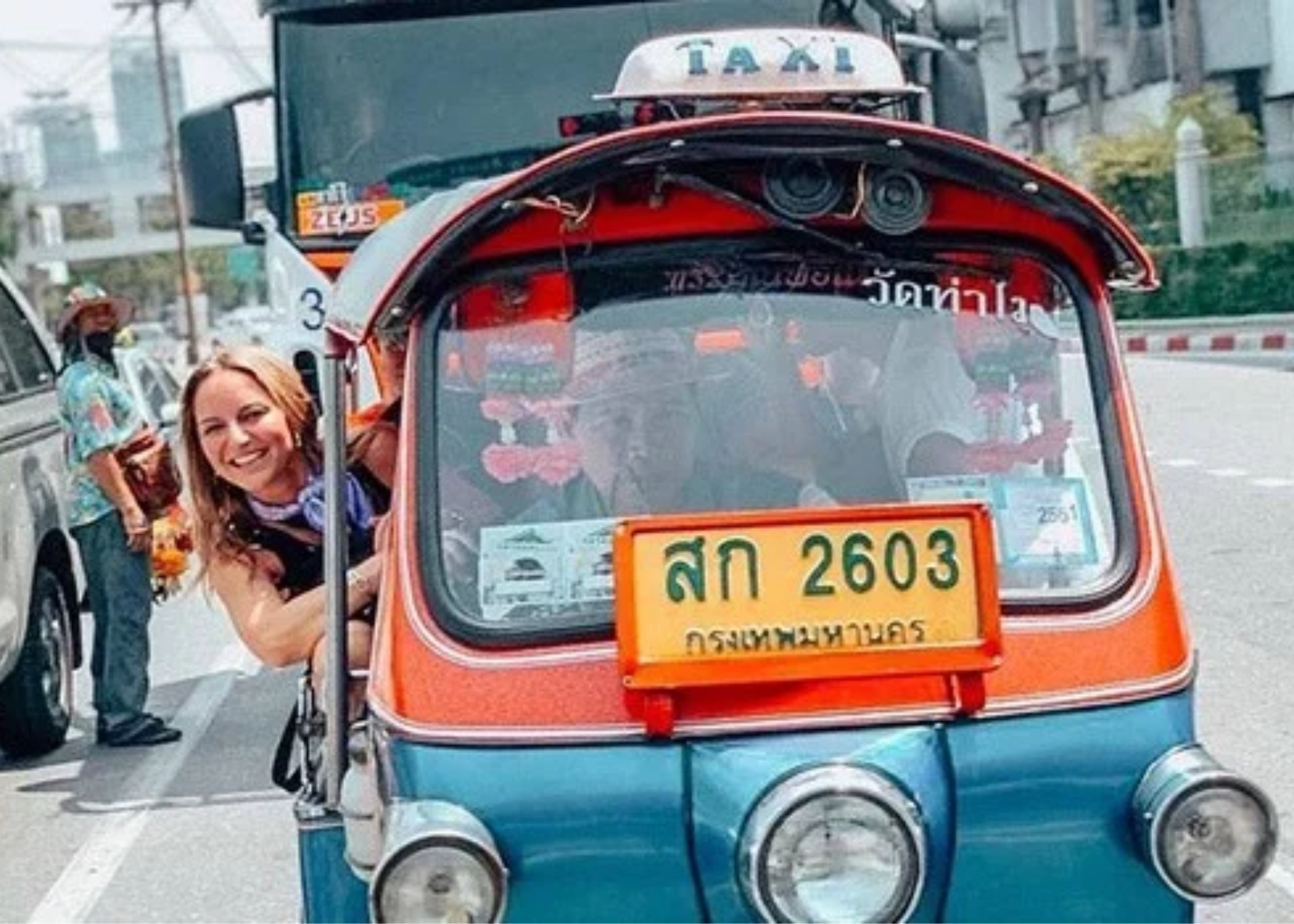 VIVE Traveler, female riding in a tuk tuk in Bangkok