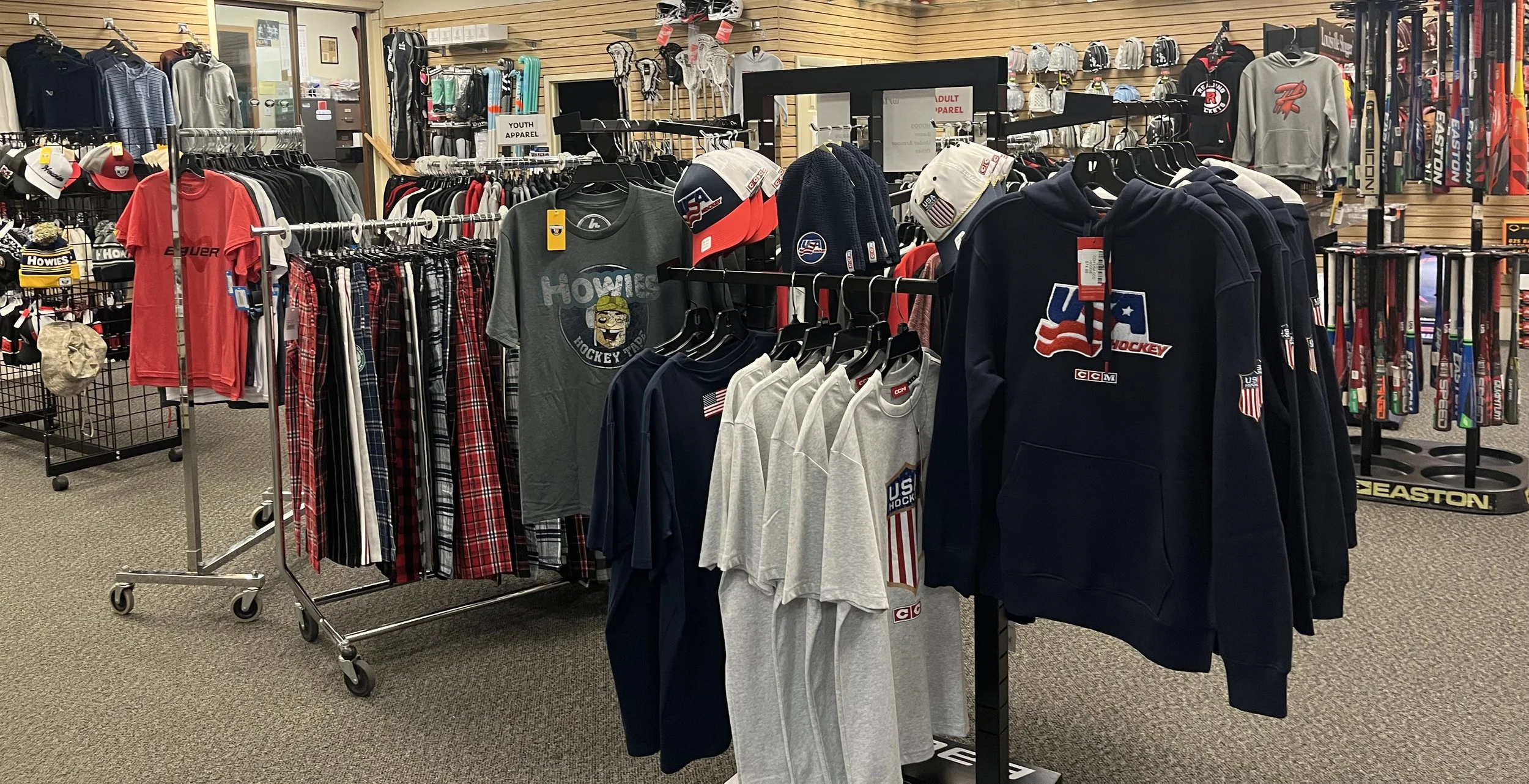 Clothing in a store on clothing racks