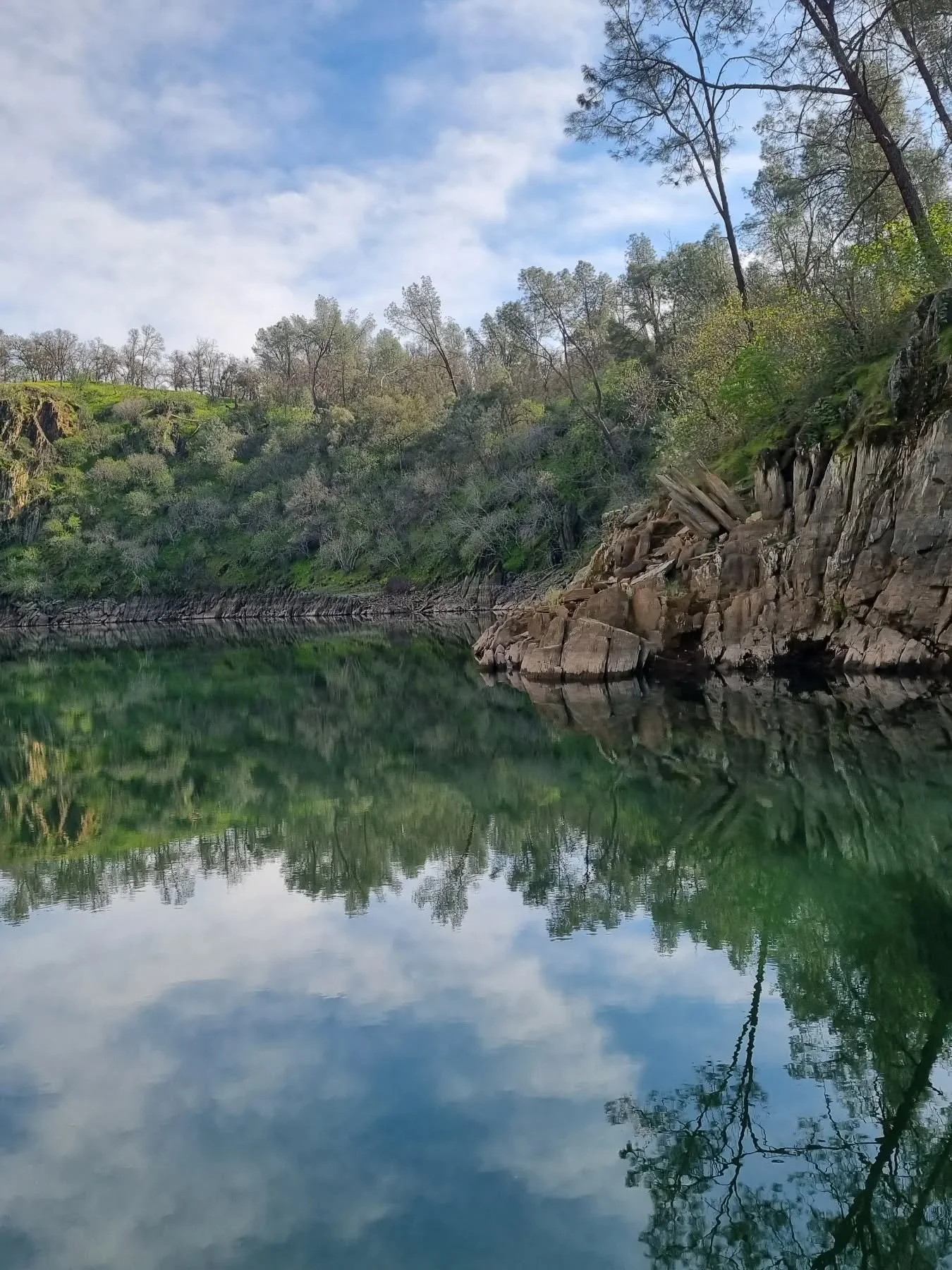 Monday feels softer when there&rsquo;s space like this.

Lake Camanche in the Narrows was completely still &mdash; no rush, no noise, just water holding the reflection of the cliffs and sky.

Belonging can feel like that.
Not loud.
Not dramatic.
Just