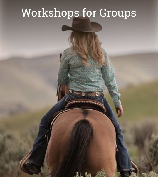 A person riding a horse across open land, symbolizing connection, reflection, and group workshop experiences at HorseSpeak