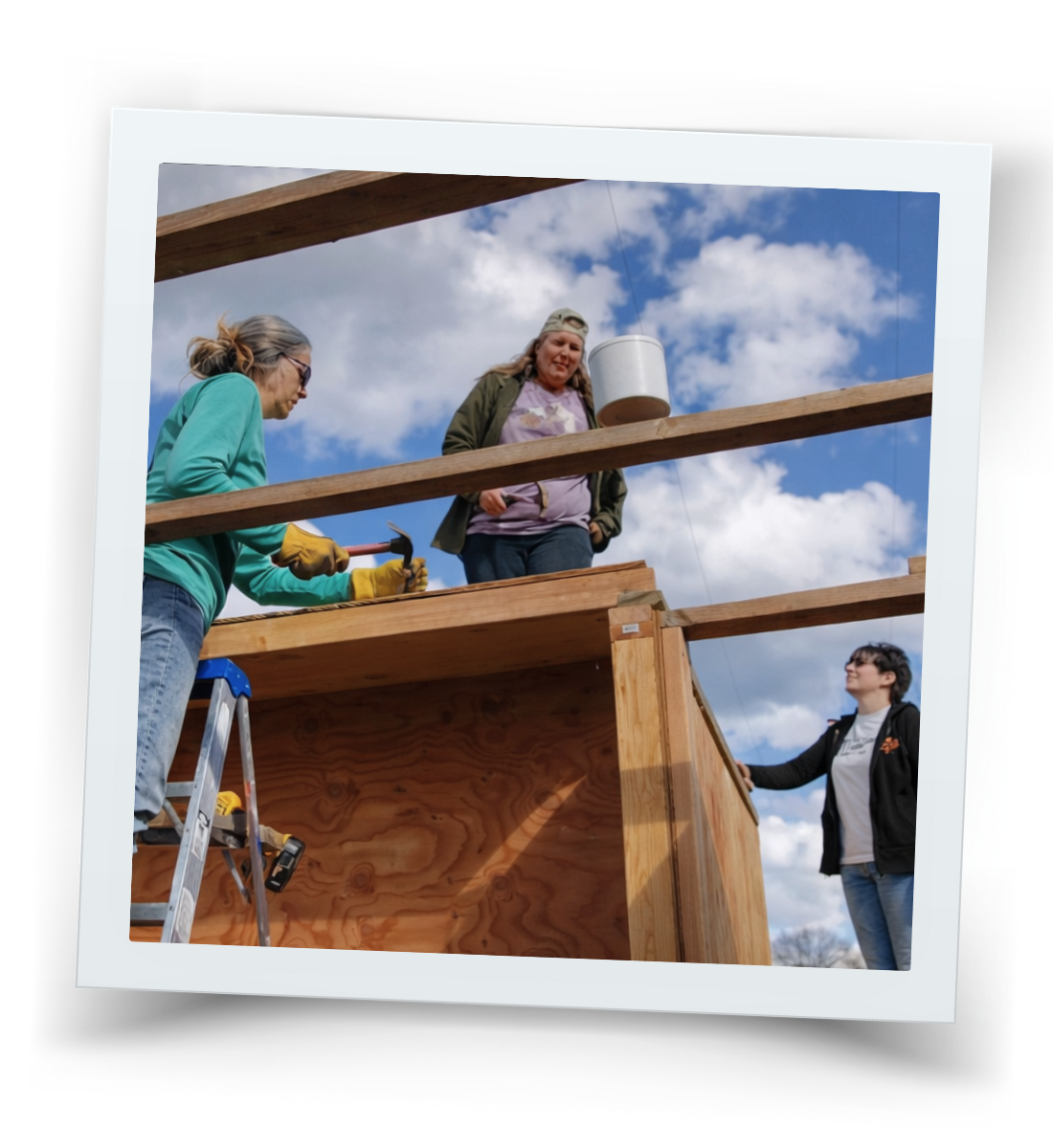 Volunteers working together to build ranch facilities in support of HorseSpeak’s equine therapy programs.
