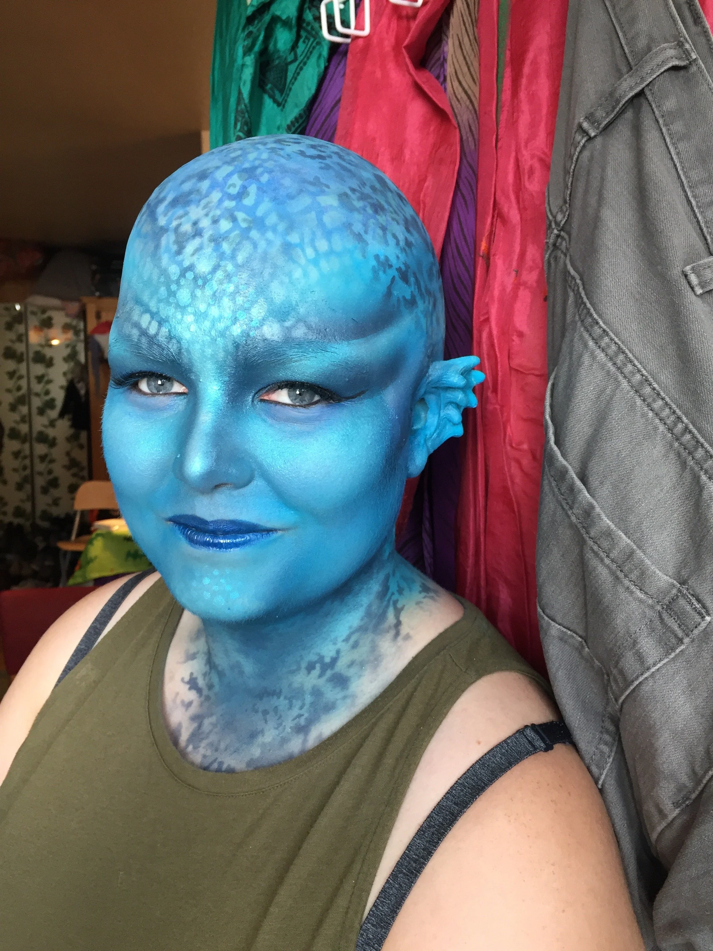 Bald cap, prosthetic ears, body painting