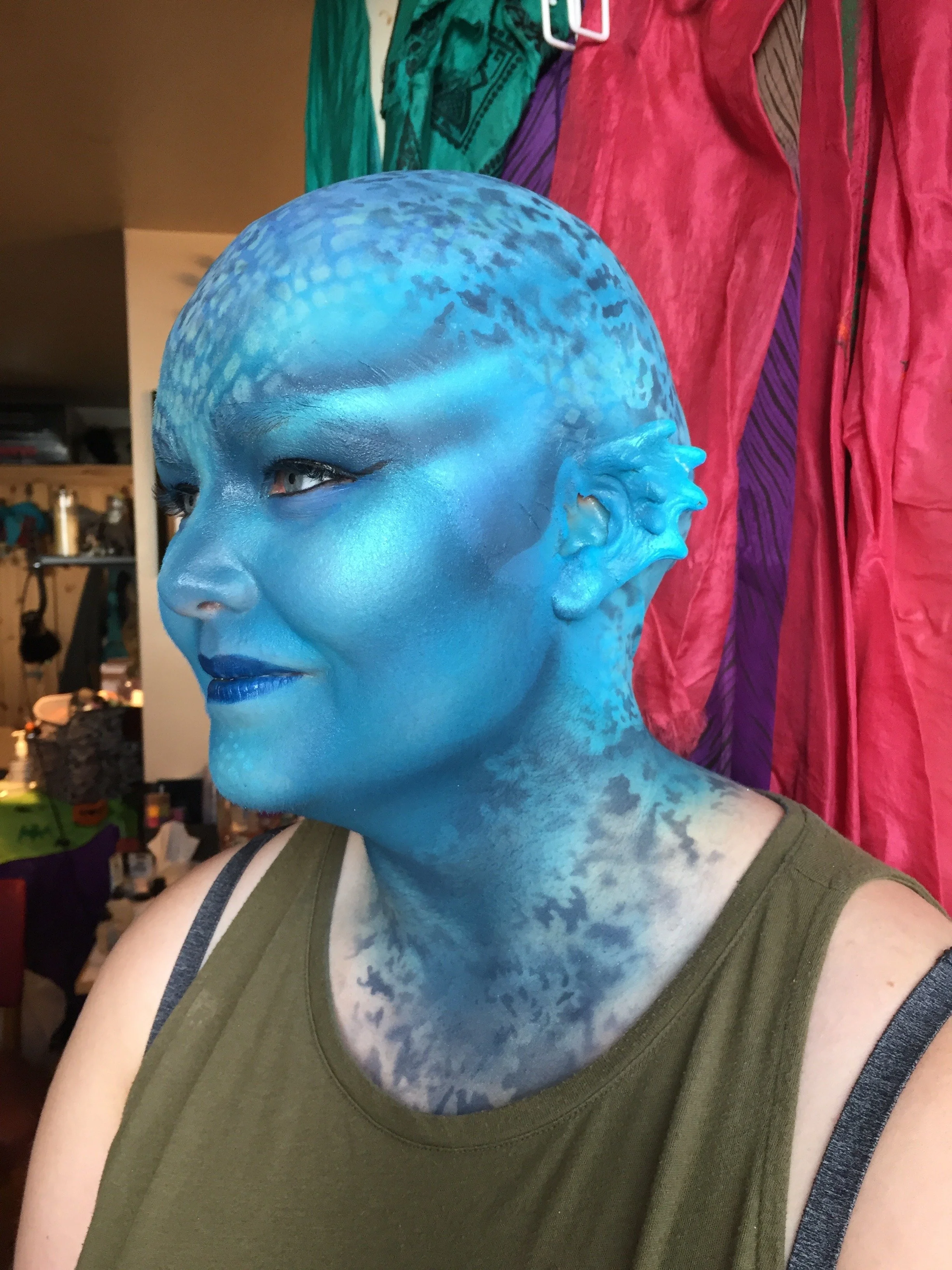 Bald cap, prosthetic ears, body painting
