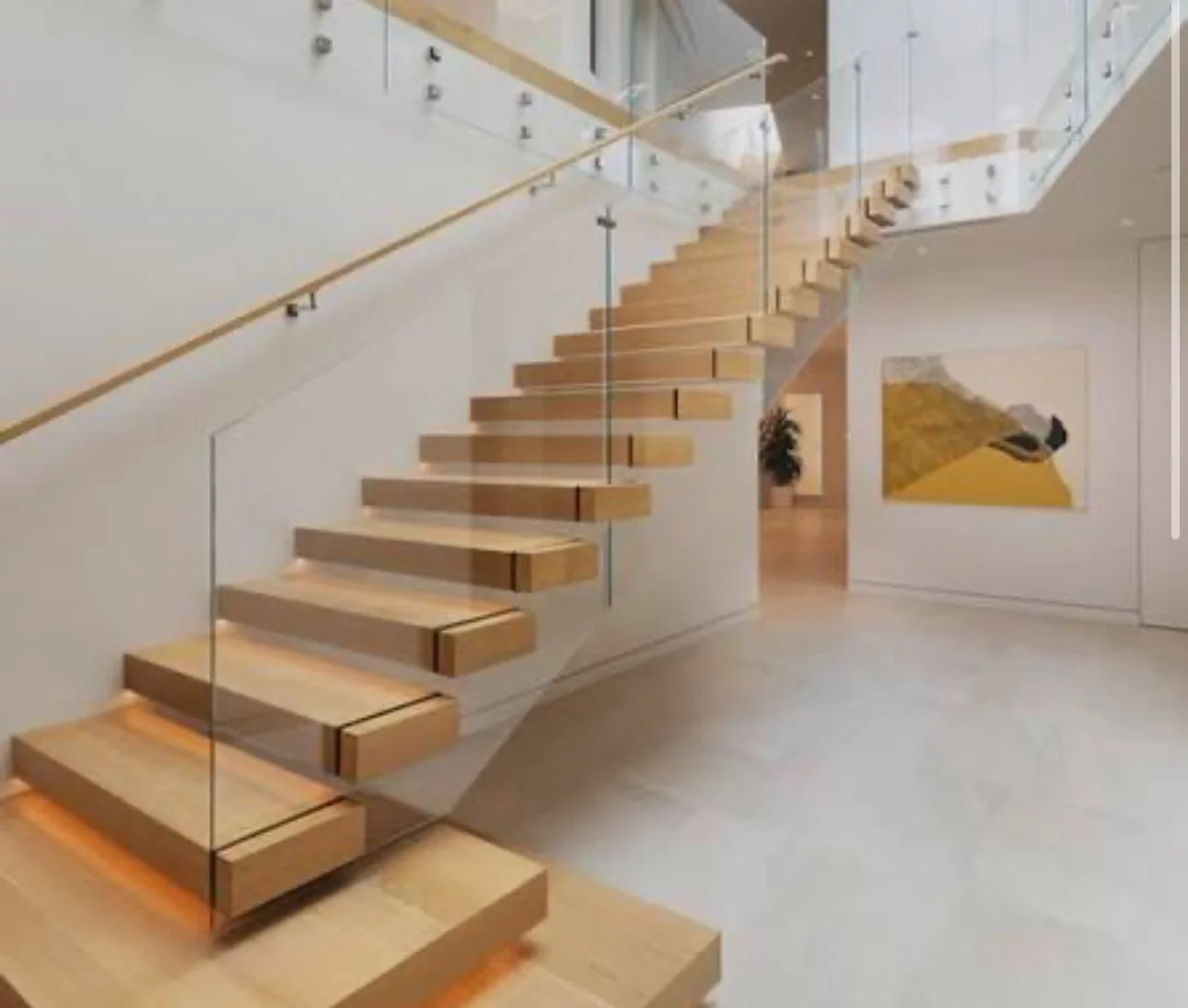 Minimalist sculpture arrangement with abstract shapes in beige and black, set against a dark textured background.