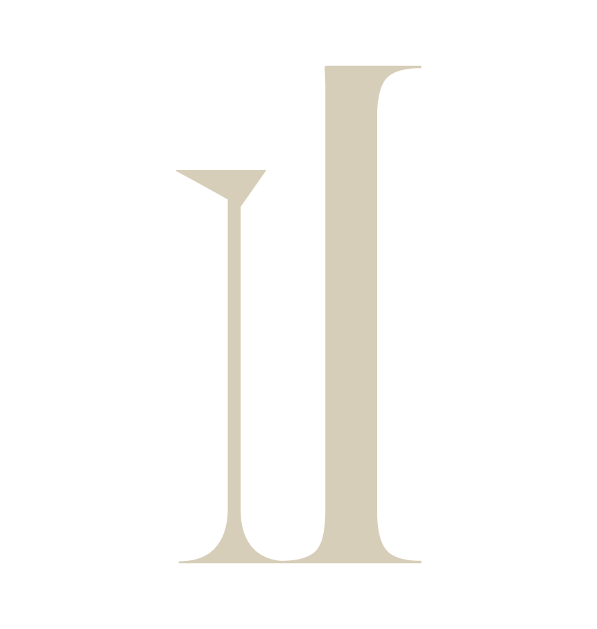 Large beige letter 'J' on a black background.
