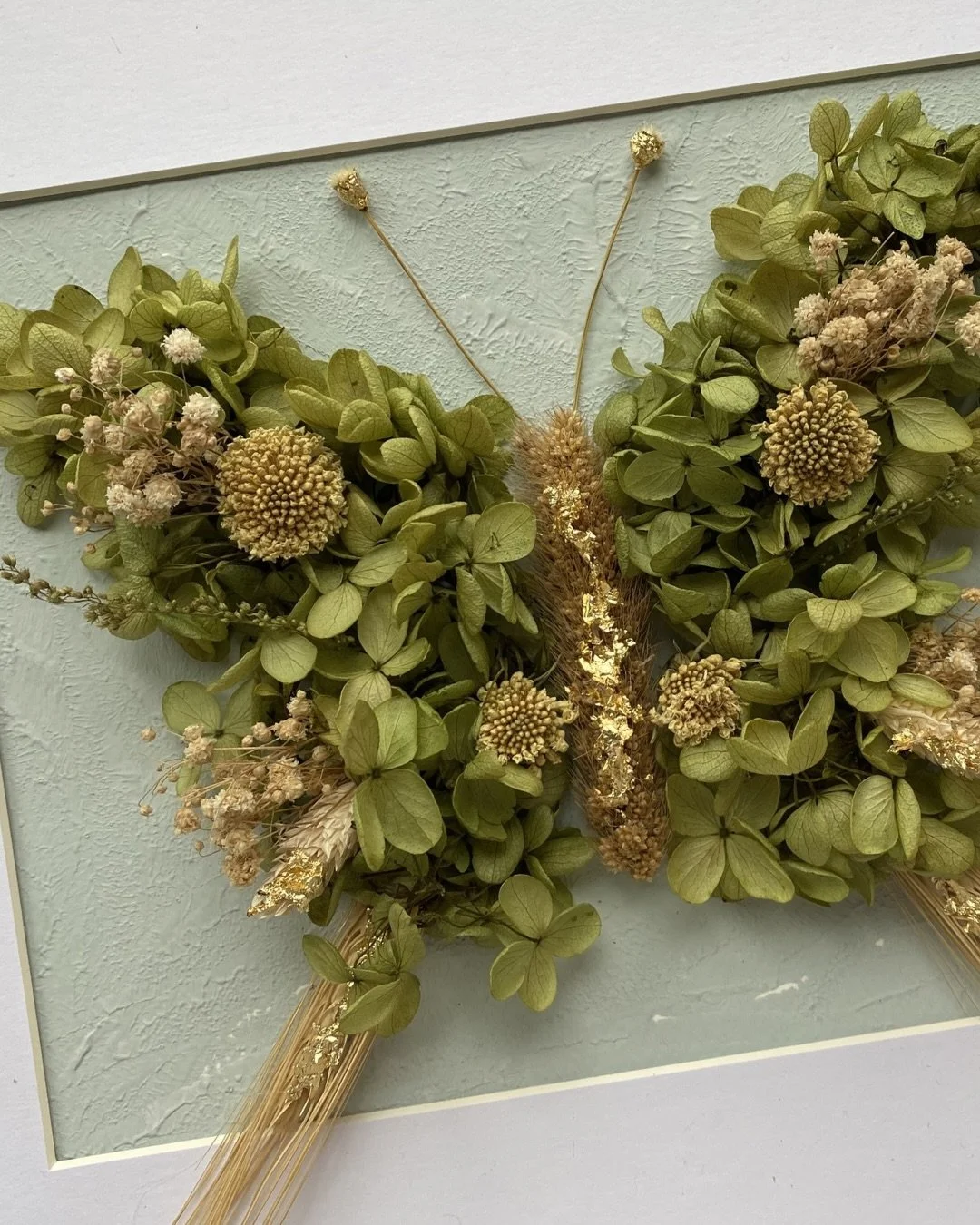 Where petals remember how to fly. 🦋

In quiet shades of green and cream, this butterfly was born from petals that once lived, now preserved in stillness&mdash;whispering that nothing is ever truly lost, only transformed.

There is a gentle magic in 