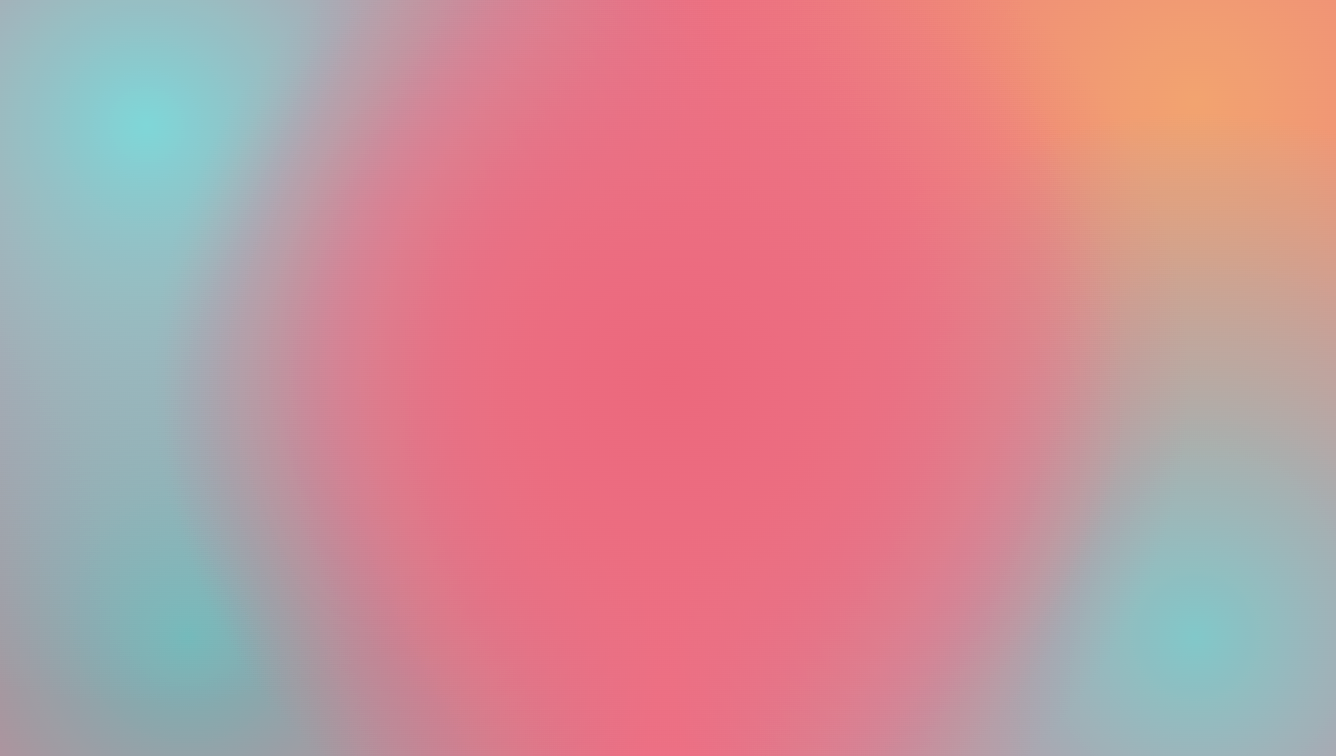 Blurred multicolored abstract background with dominant pink and teal shades.