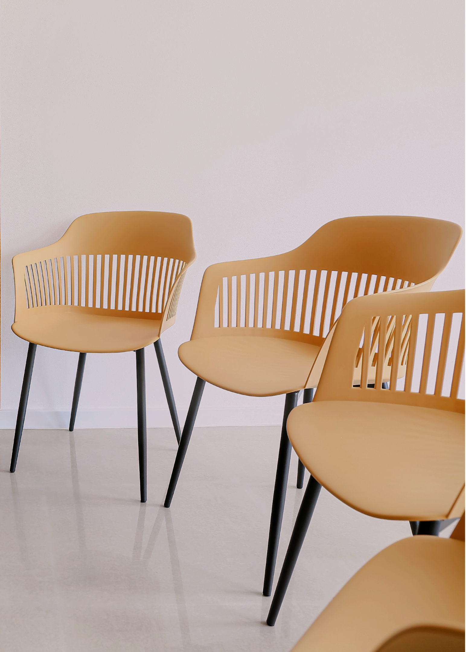 Three modern chairs arranged for a group therapy session