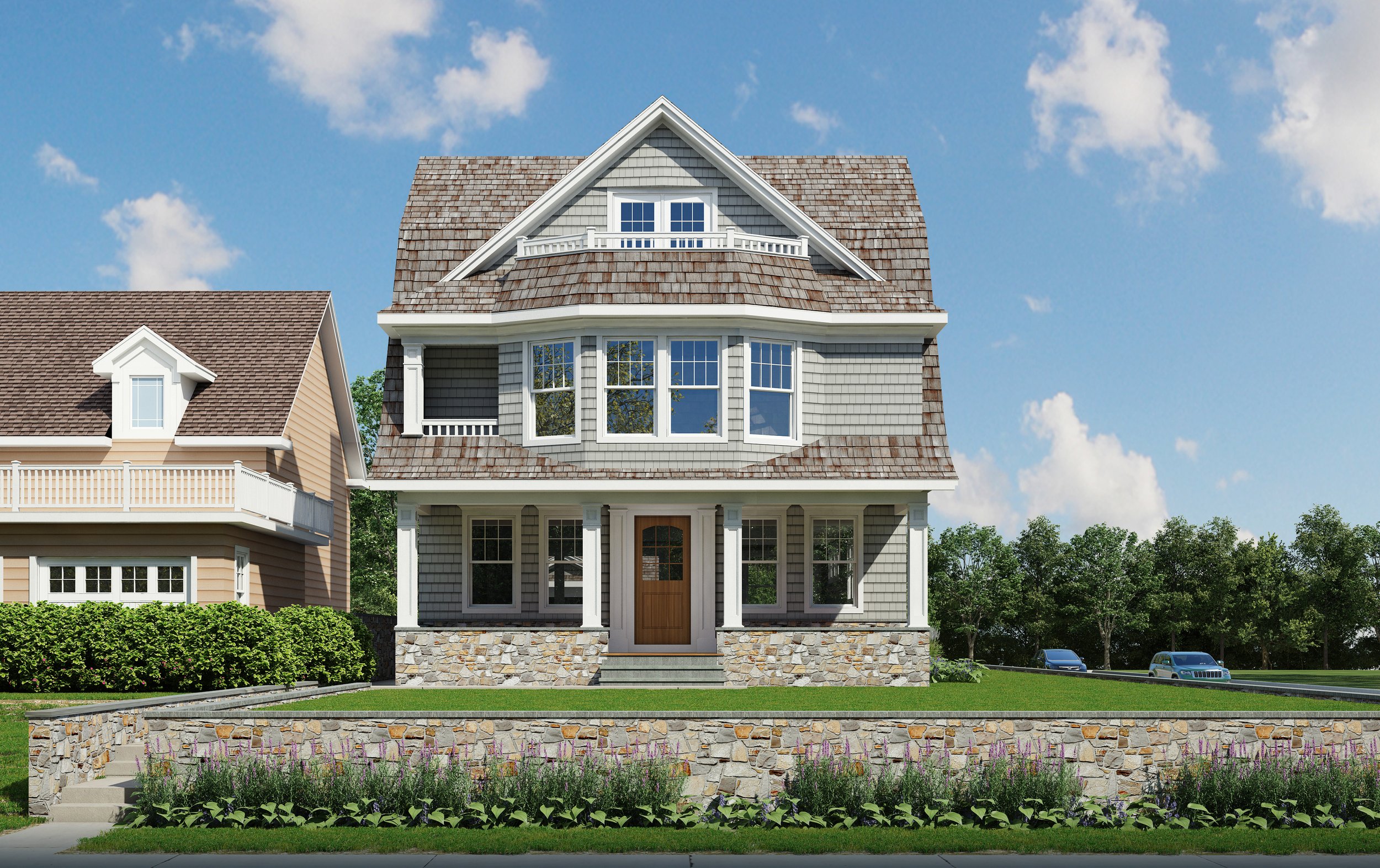 A three-story traditional house with gray siding, brown shingle roof, and front porch, surrounded by a well-maintained lawn and flowerbed, with trees and parked cars in the background under a blue sky.