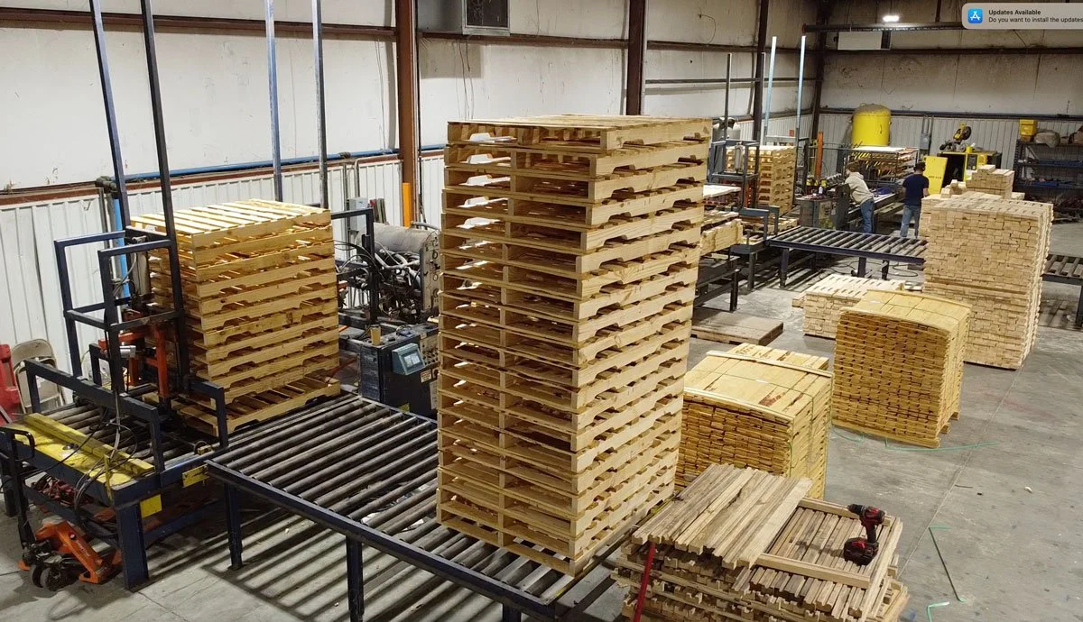 pallets stacked inside pallet manufacturing building and assembly