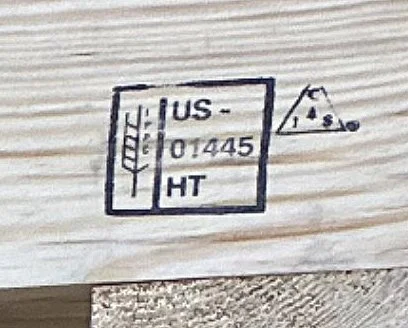closeup of a wooden pallet with Woodcraft's heat treated stamp